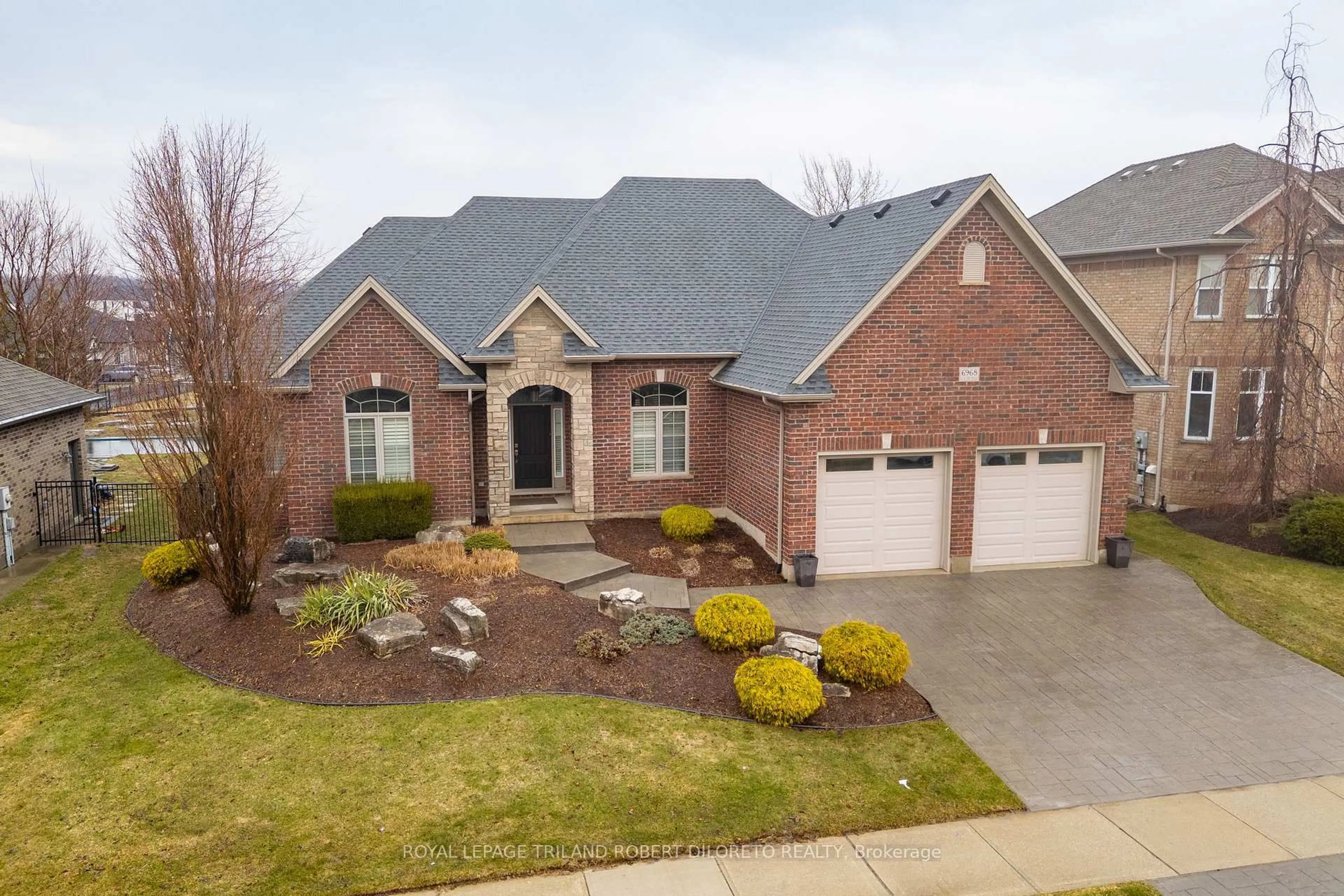Home with brick exterior material, street for 6968 Clayton Walk, London South Ontario N6P 0B2