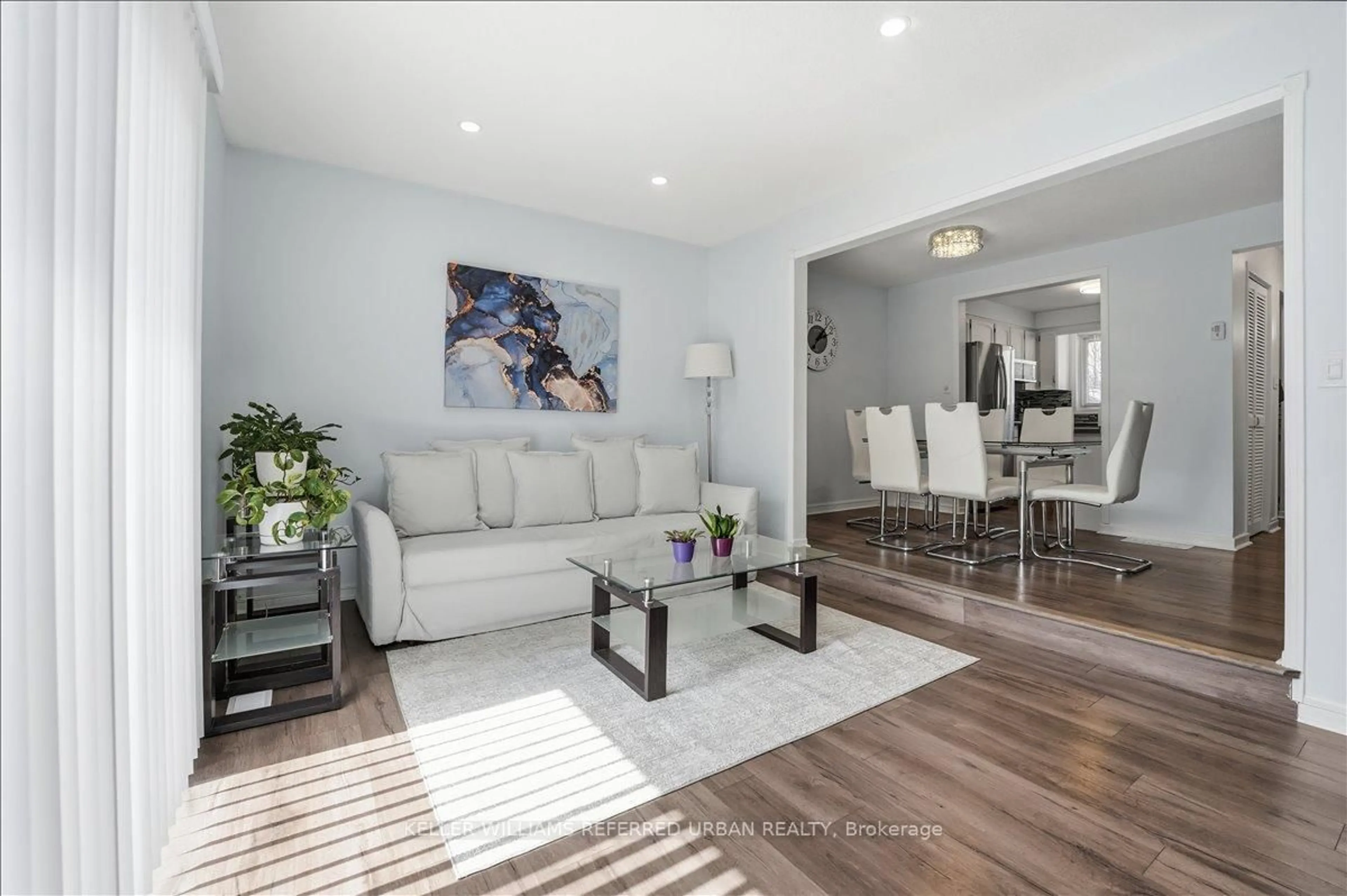 Living room with furniture, wood/laminate floor for 151 Linwell Rd #63, St. Catharines Ontario L2N 6P3