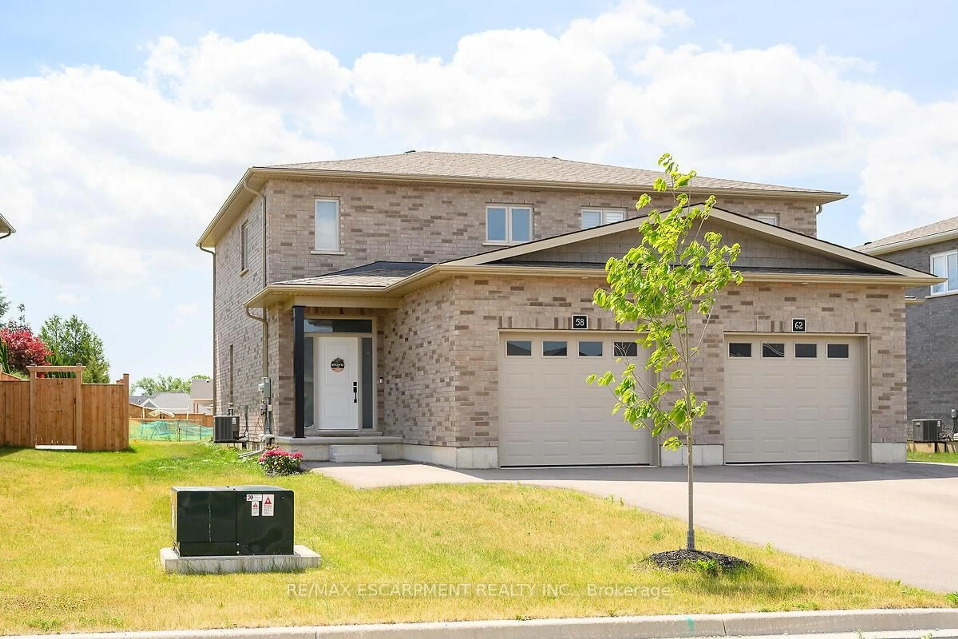 Home with brick exterior material, street for 58 Peachleaf Lane, Norfolk Ontario N0E 1Y0