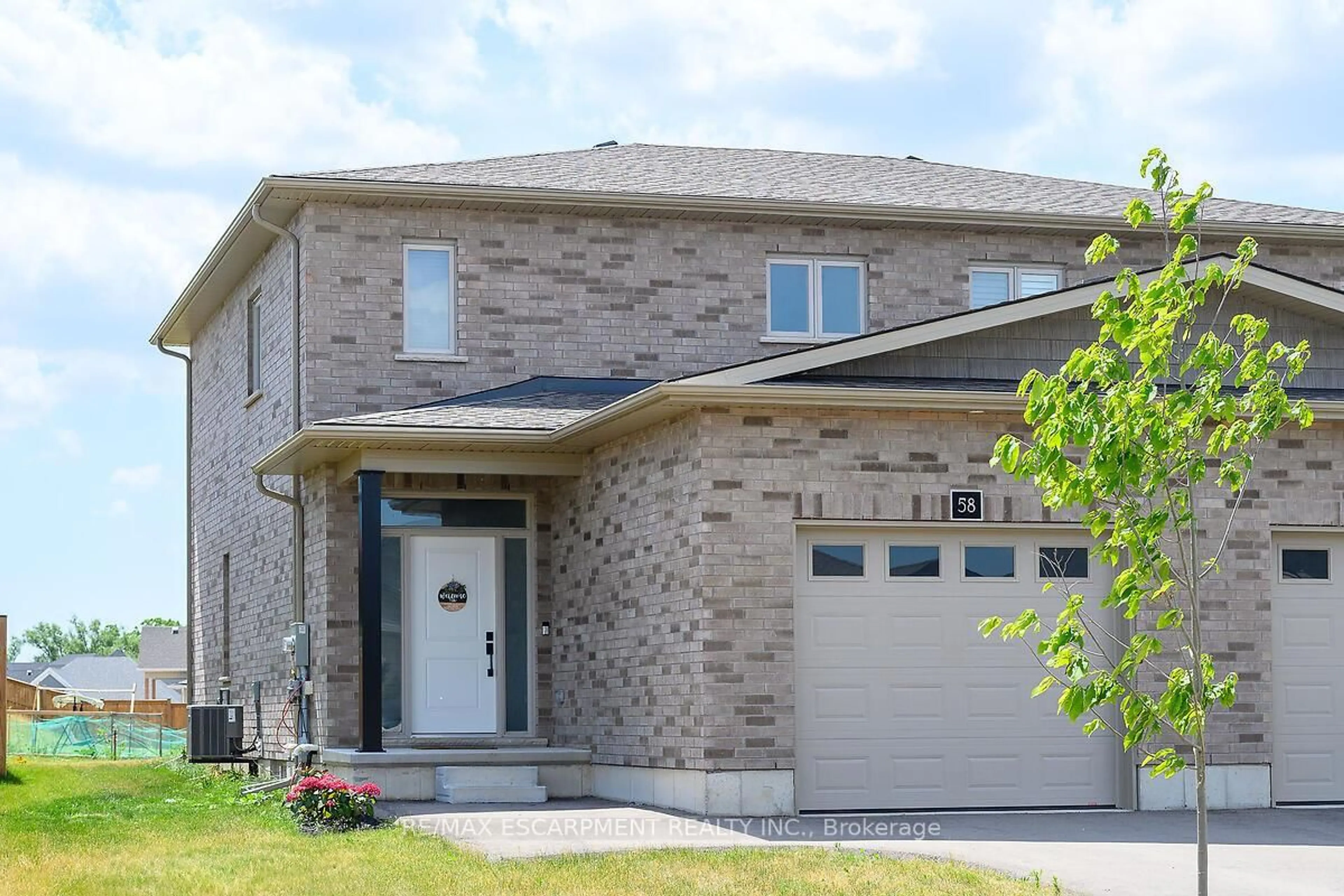 Home with brick exterior material, street for 58 Peachleaf Lane, Norfolk Ontario N0E 1Y0