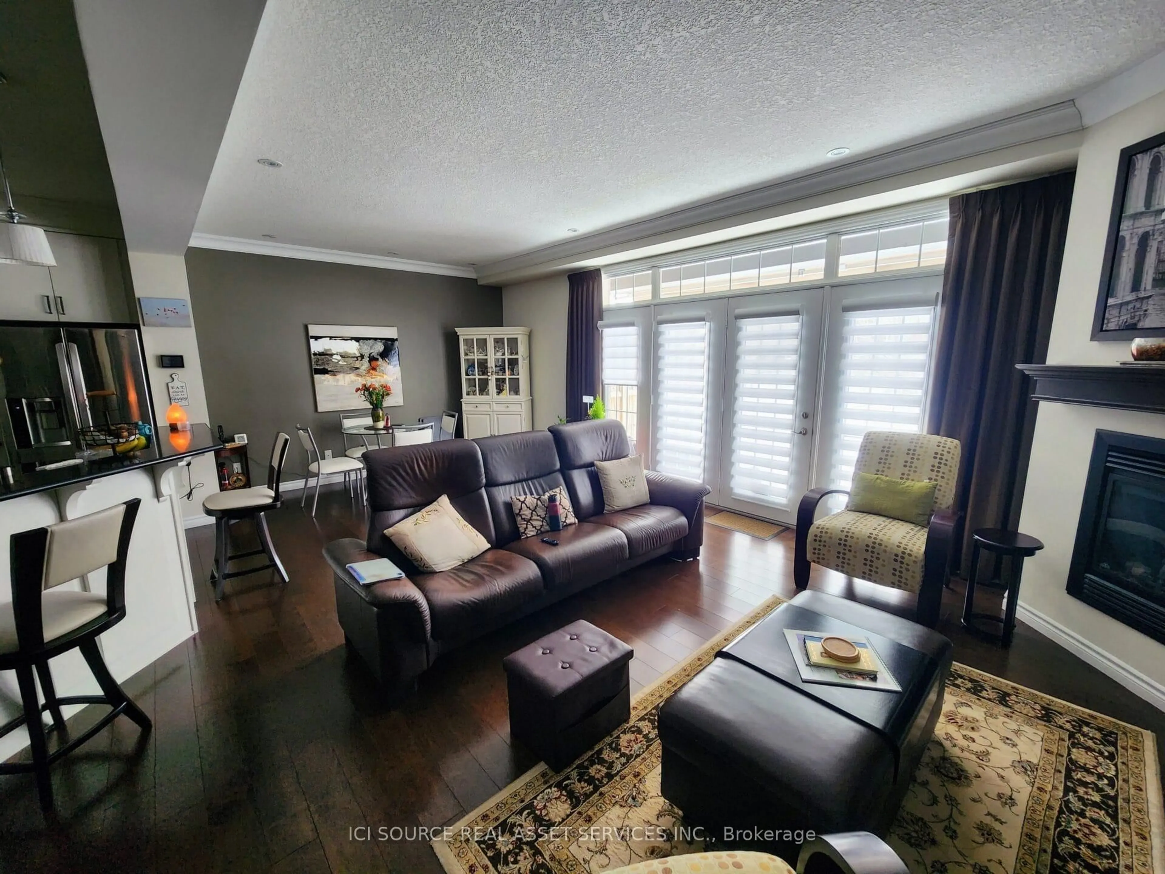 Living room with furniture, wood/laminate floor for 435 Winchester Dr #10, Waterloo Ontario N2T 0B7