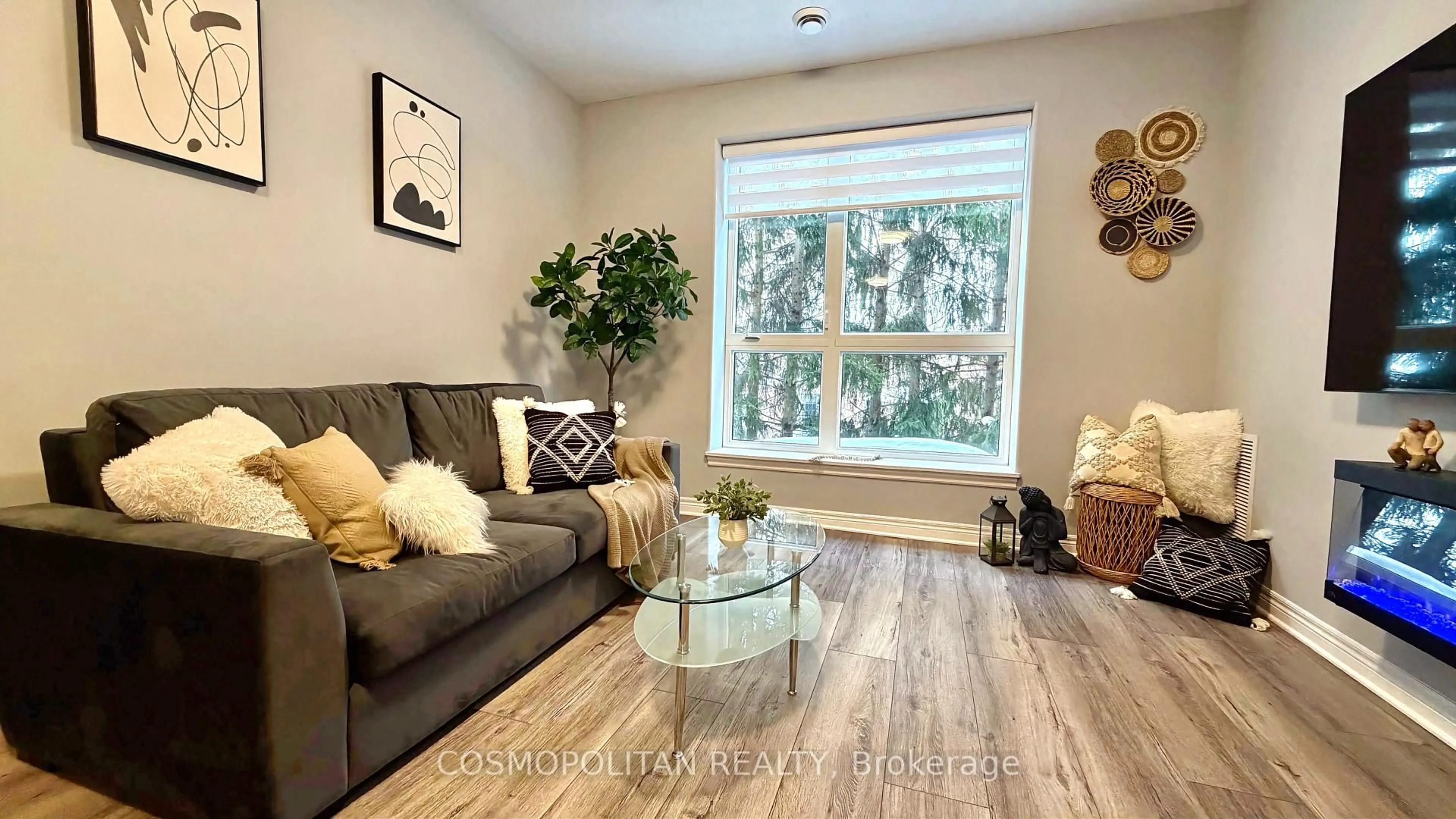 Living room with furniture, wood/laminate floor for 2799 St. Paul Ave #204, Niagara Falls Ontario L2J 2L3