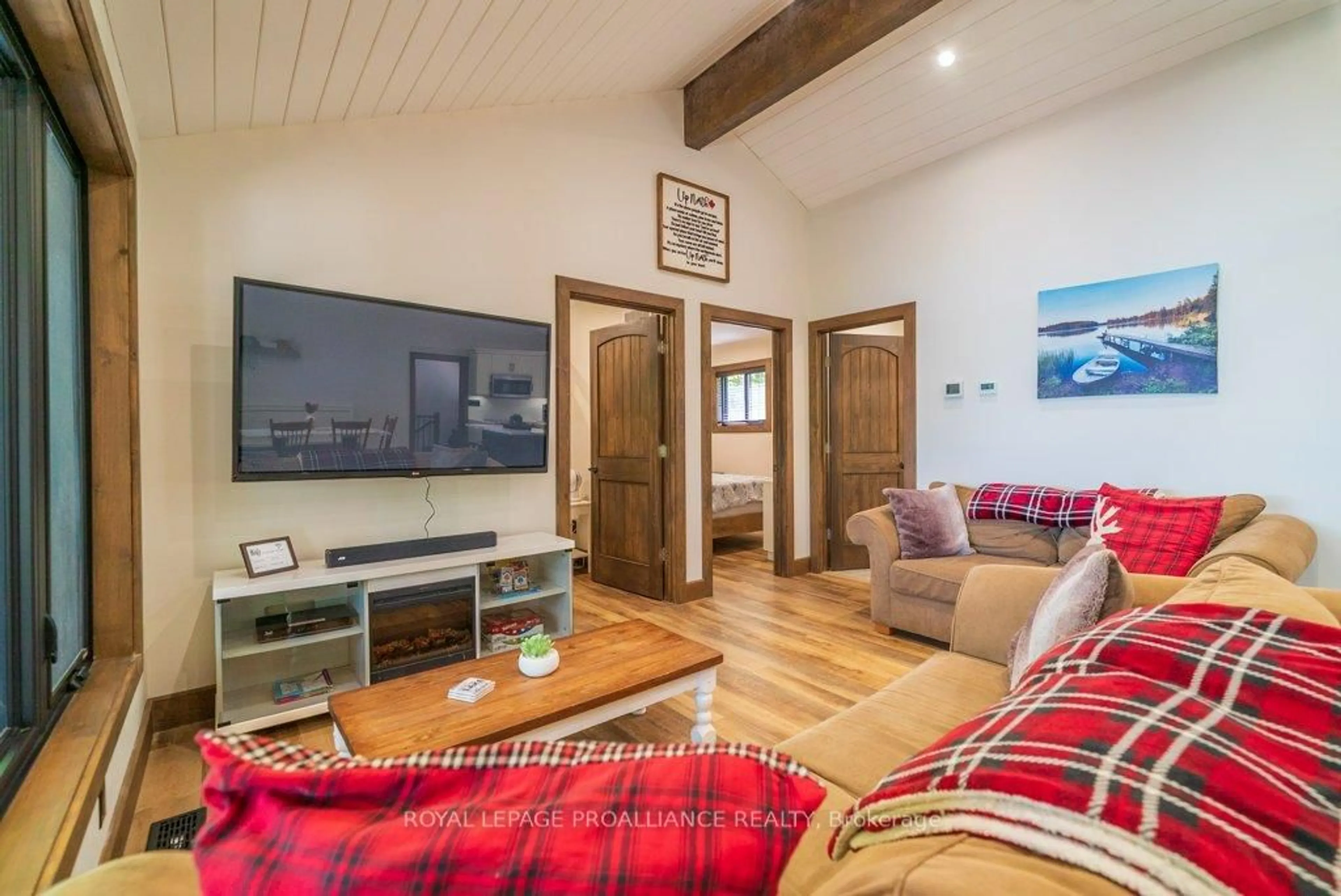 Living room with furniture, wood/laminate floor for 1202 Rocky Lane, Cloyne Ontario K0H 1K0