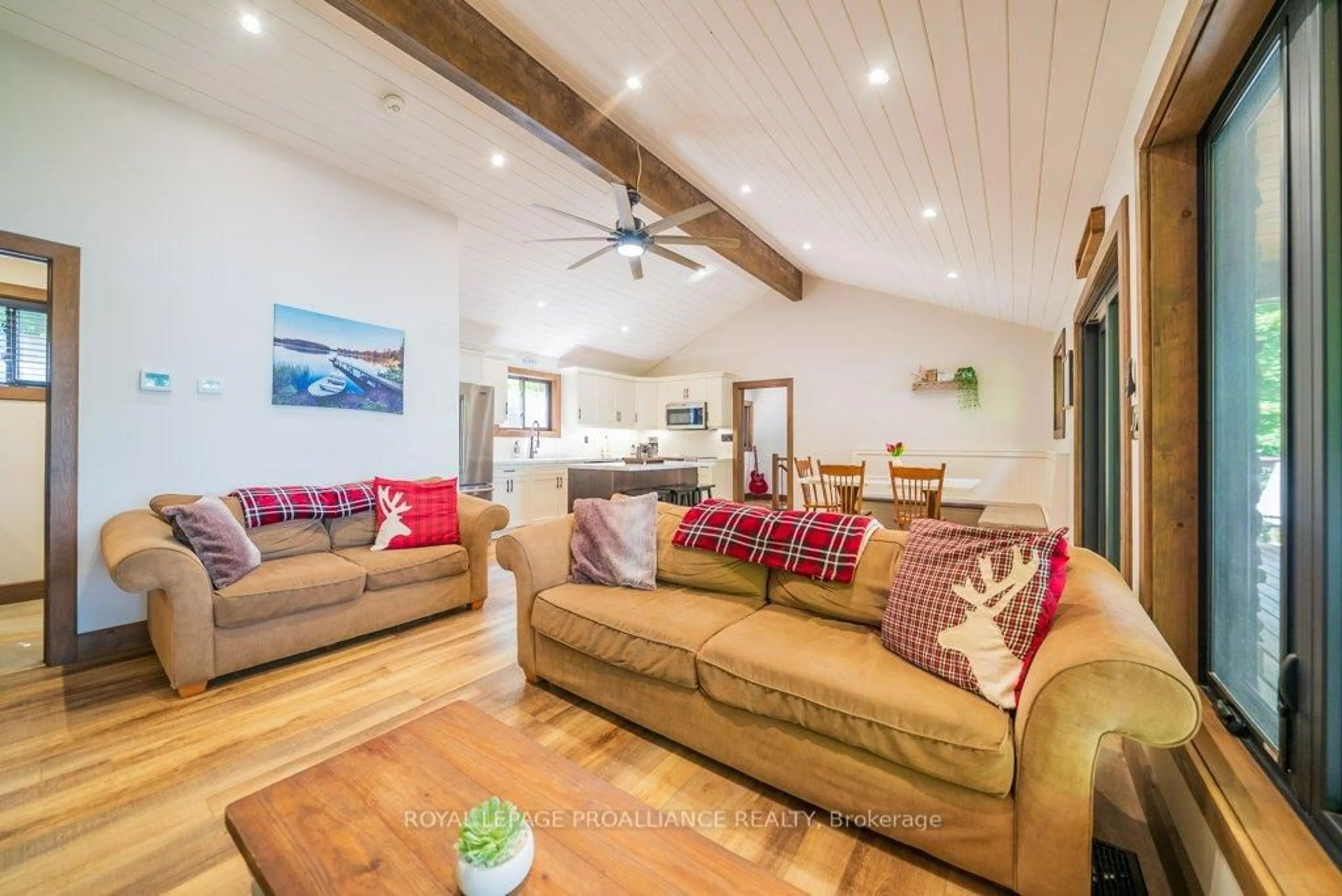 Living room with furniture, wood/laminate floor for 1202 Rocky Lane, Cloyne Ontario K0H 1K0