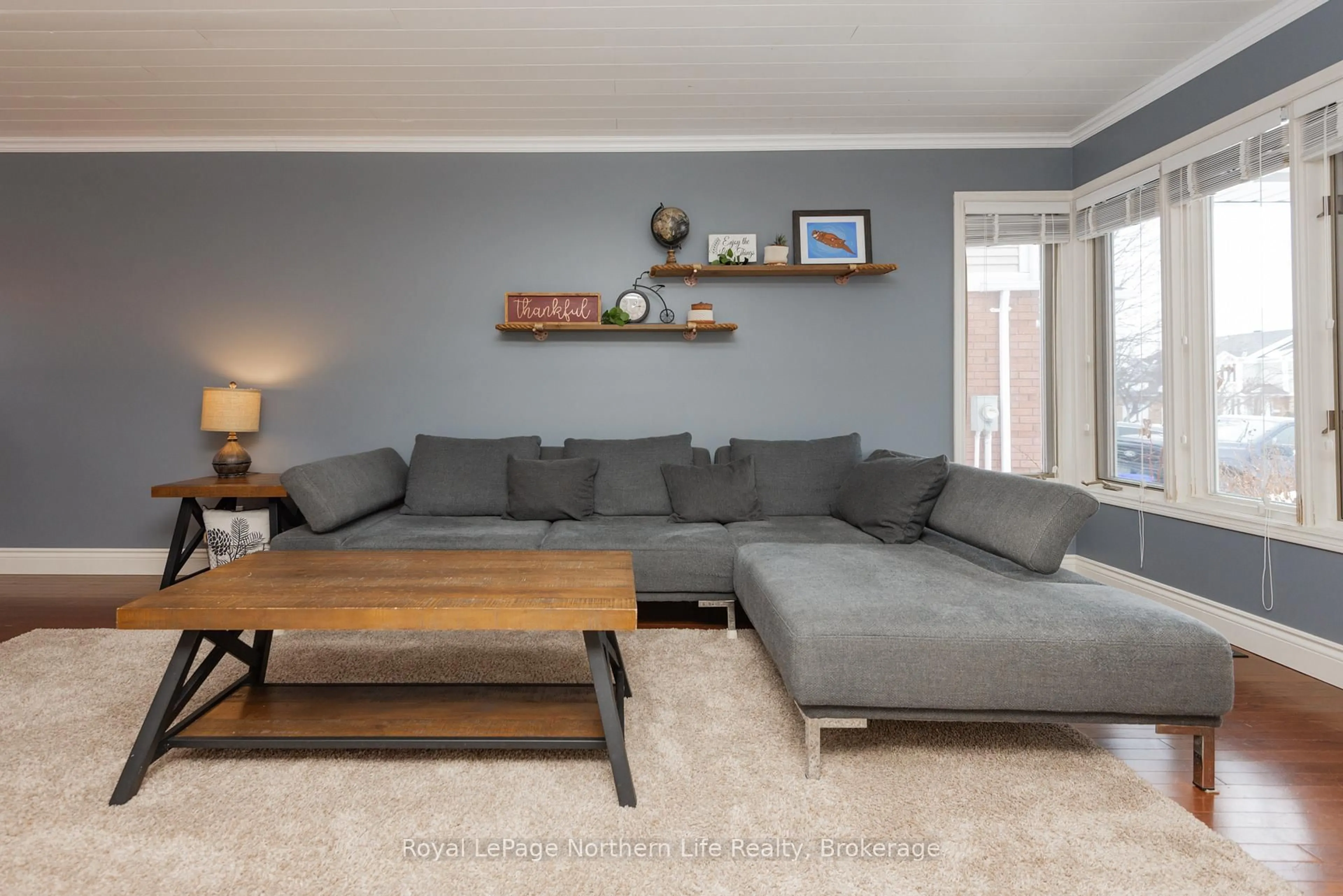 Living room with furniture, wood/laminate floor for 235 Labreche Dr, North Bay Ontario P1A 4J6