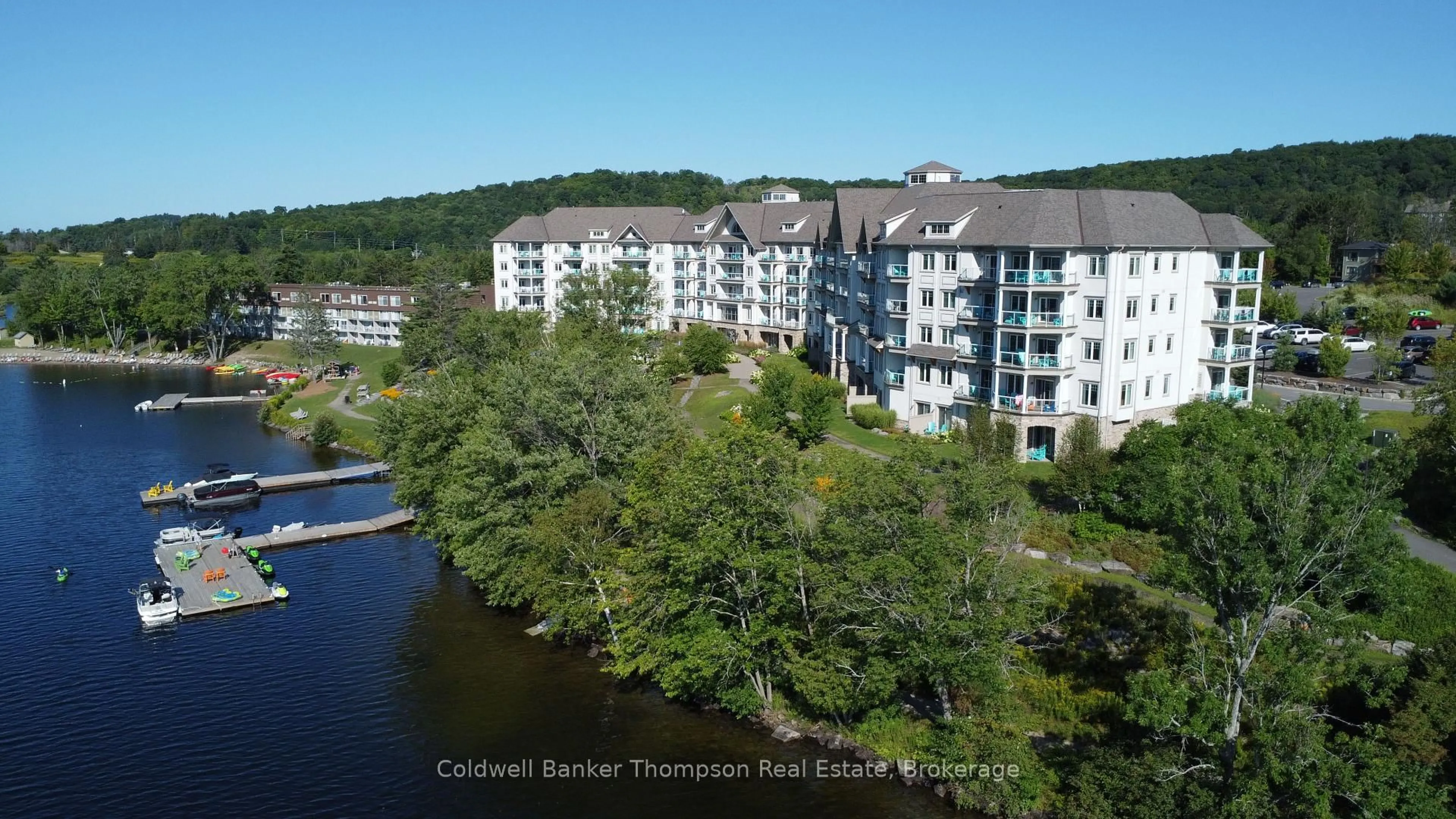 A pic from outside/outdoor area/front of a property/back of a property/a pic from drone, water/lake/river/ocean view for 25 PEN LAKE POINT Rd #216, Huntsville Ontario P1H 1A9