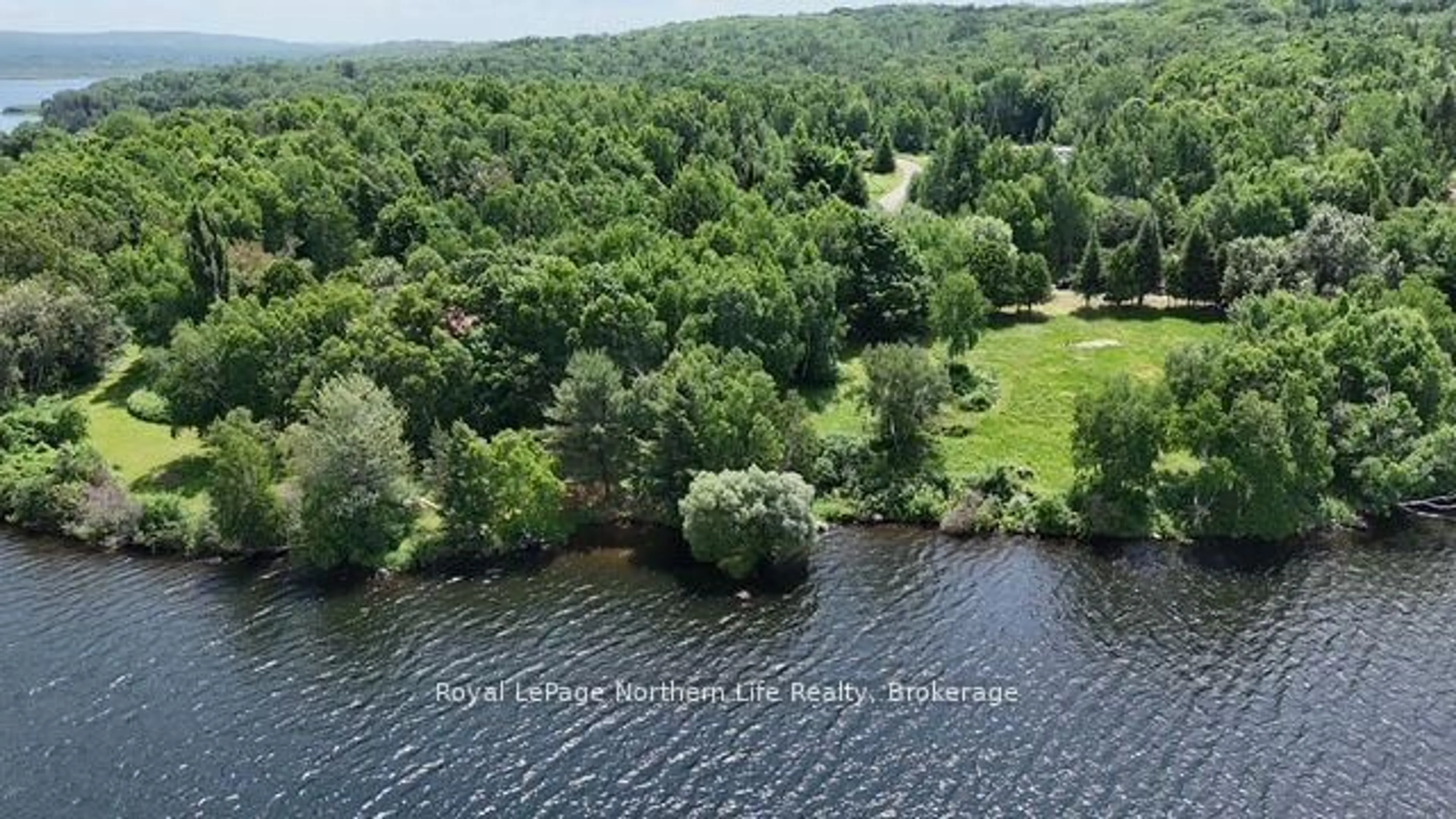 A pic from outside/outdoor area/front of a property/back of a property/a pic from drone, water/lake/river/ocean view for 106 Cedar Bay Rd, East Ferris Ontario P0H 1B0