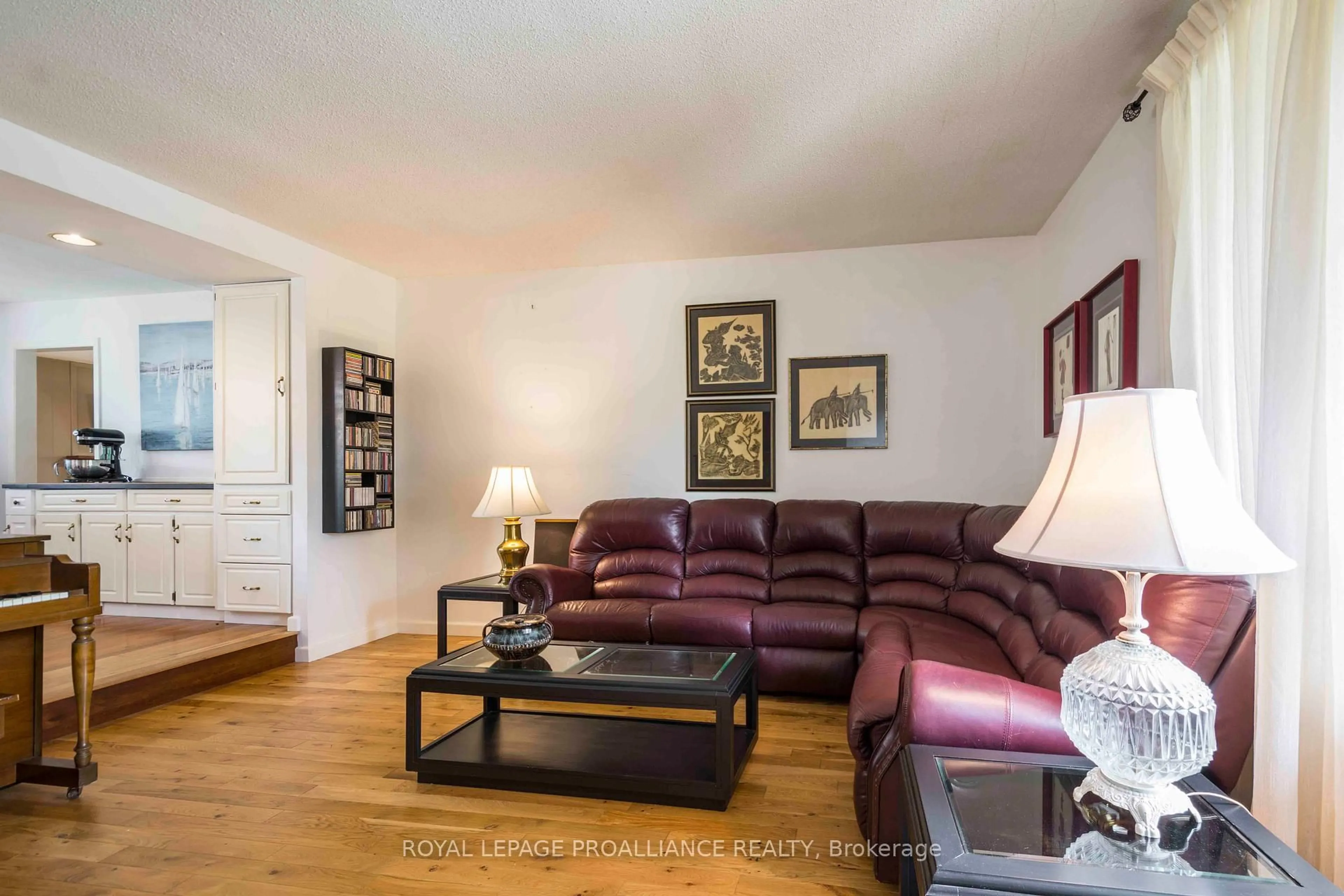 Living room with furniture, wood/laminate floor for 12 Montrose Rd, Quinte West Ontario K8R 1A3