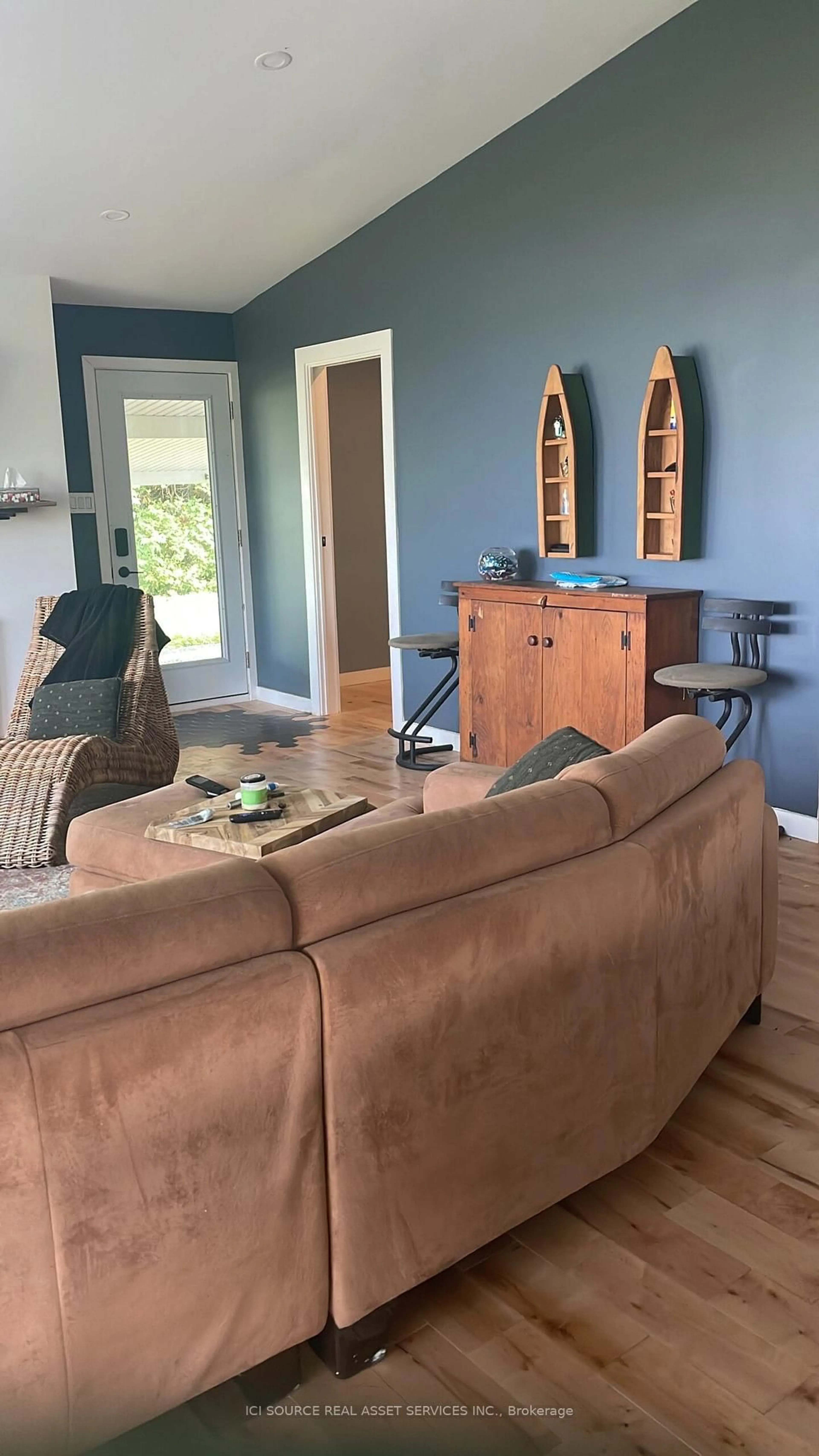 Living room with furniture, wood/laminate floor for 20586 Old Montreal Rd, South Glengarry Ontario K0C 2C0