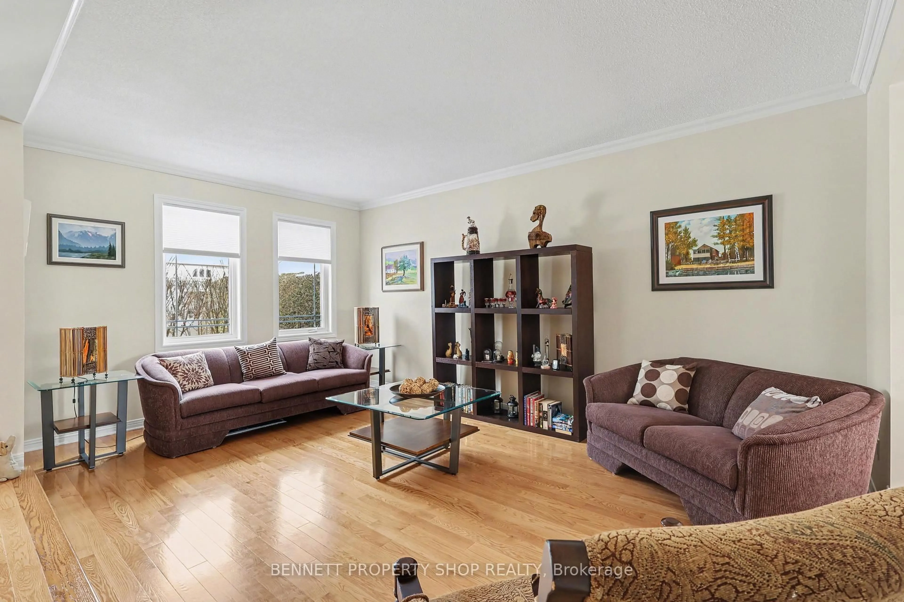 Living room with furniture, wood/laminate floor for 1476 Bourcier Dr, Orleans Ontario K1E 3J8