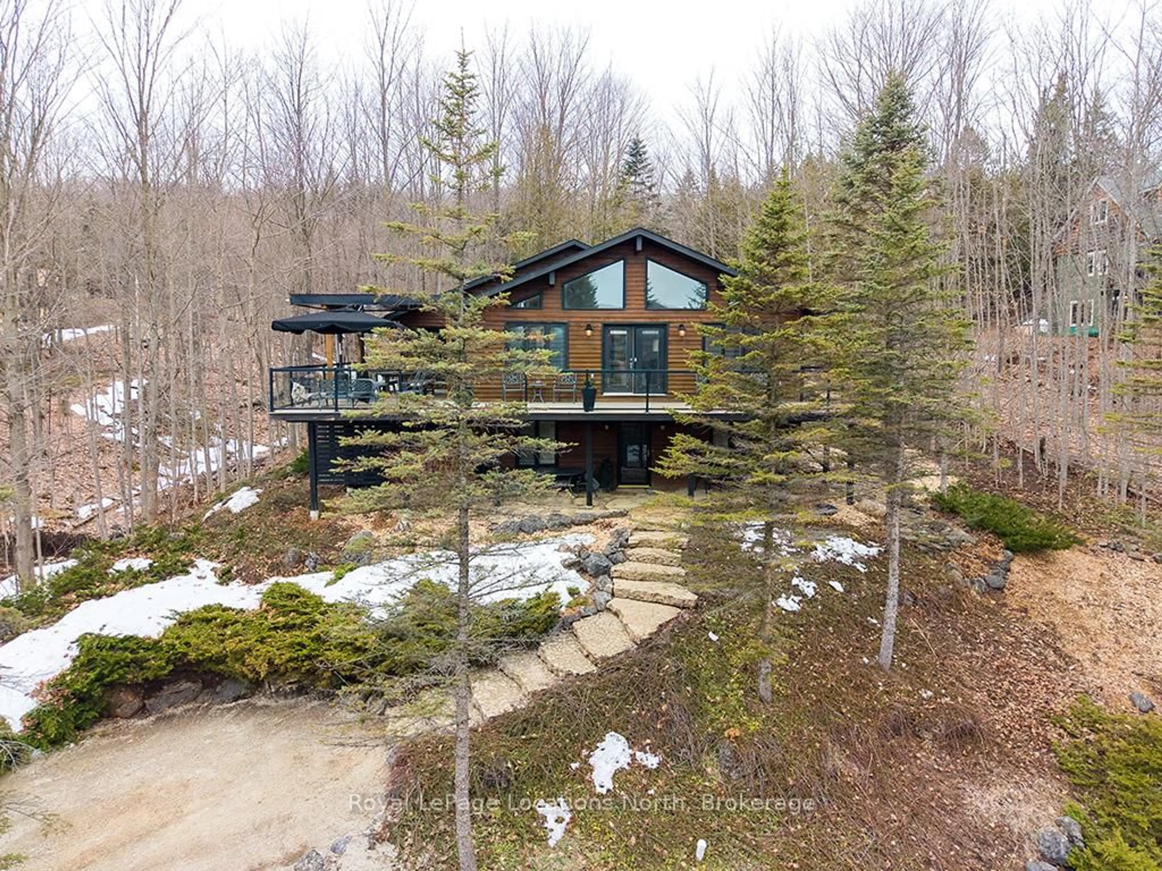 A pic from outside/outdoor area/front of a property/back of a property/a pic from drone, forest/trees view for 112 Amik Crt, Grey Highlands Ontario N0C 1G0
