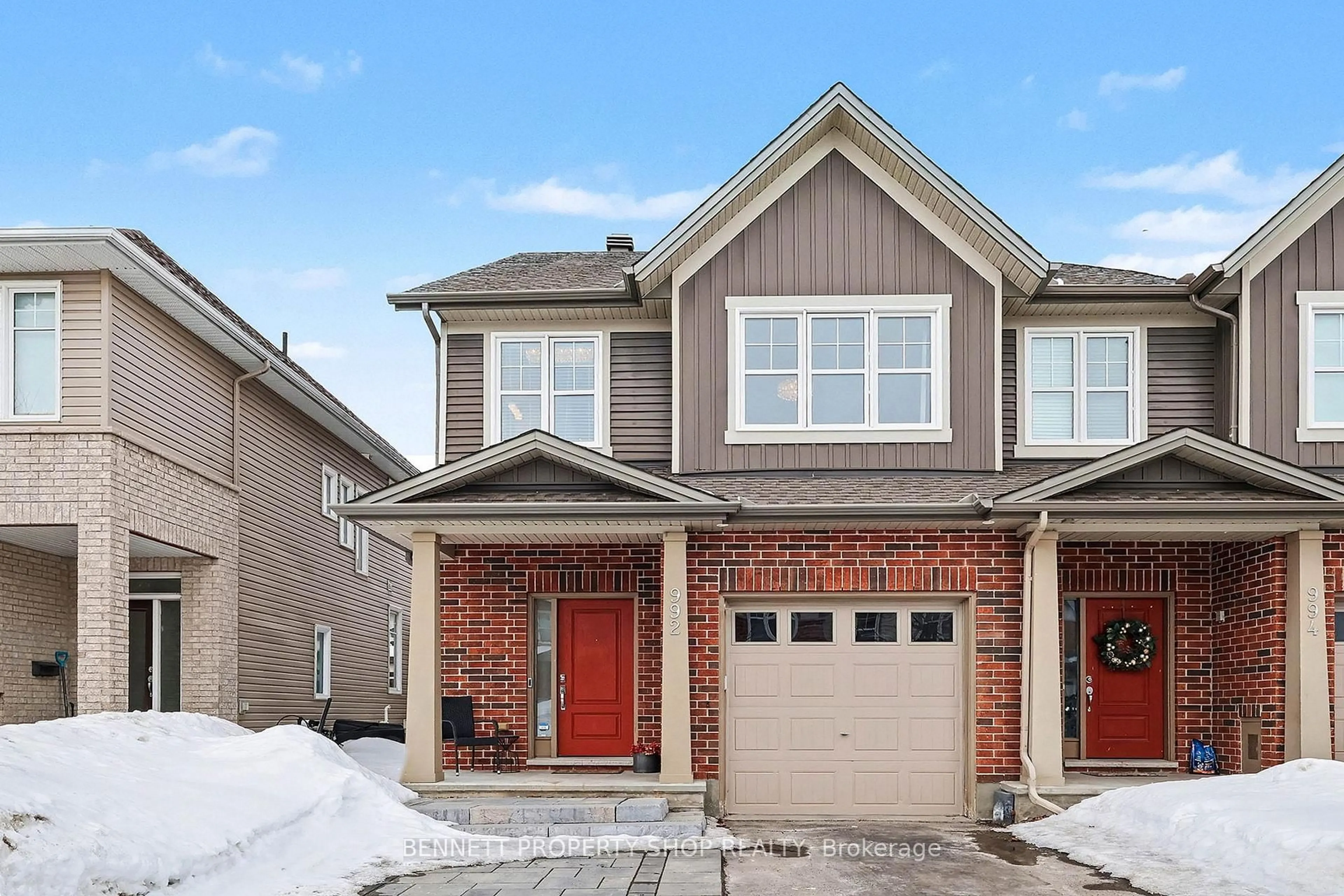 Home with brick exterior material, street for 992 Bunchberry Way, Ottawa Ontario K1T 0L6