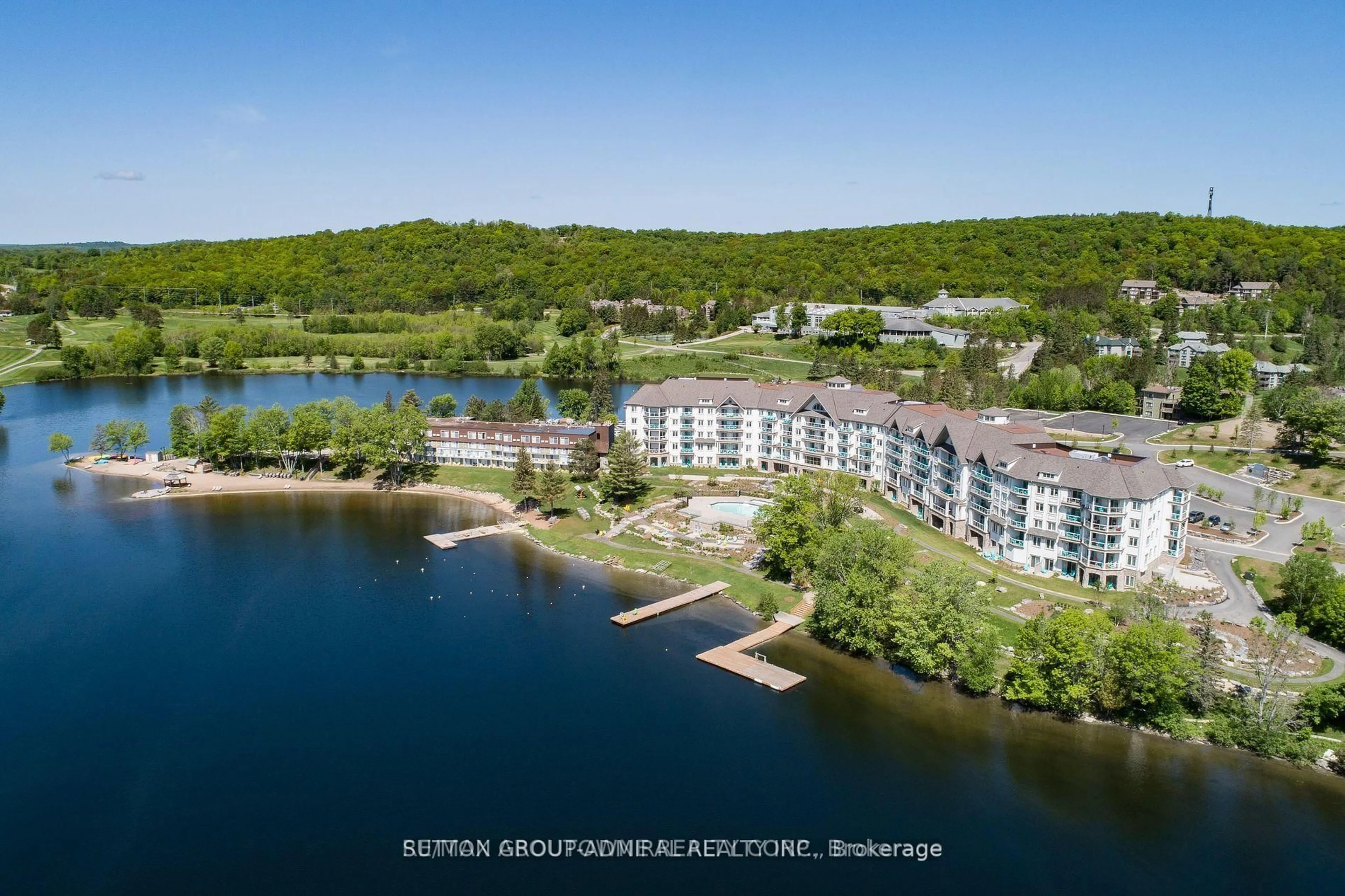 A pic from outside/outdoor area/front of a property/back of a property/a pic from drone, water/lake/river/ocean view for 25 Pen Lake Point Rd #425, Huntsville Ontario P1H 1A9