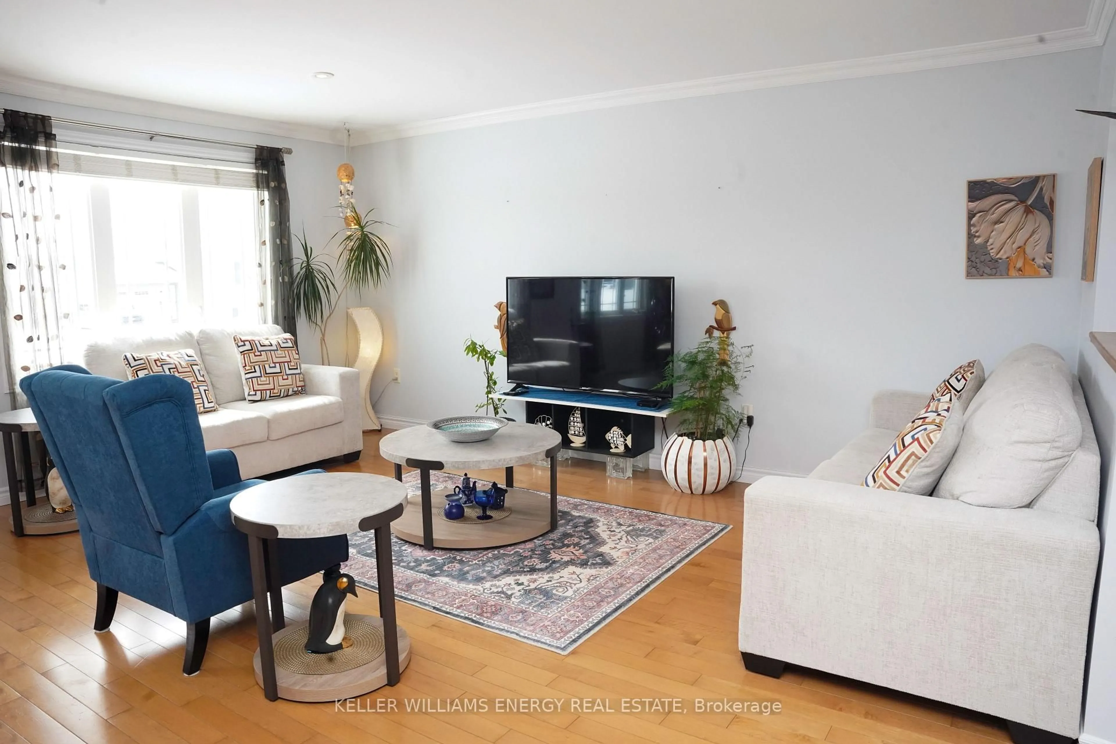 Living room with furniture, wood/laminate floor for 11 Morning Star St, Petawawa Ontario K8H 0A1