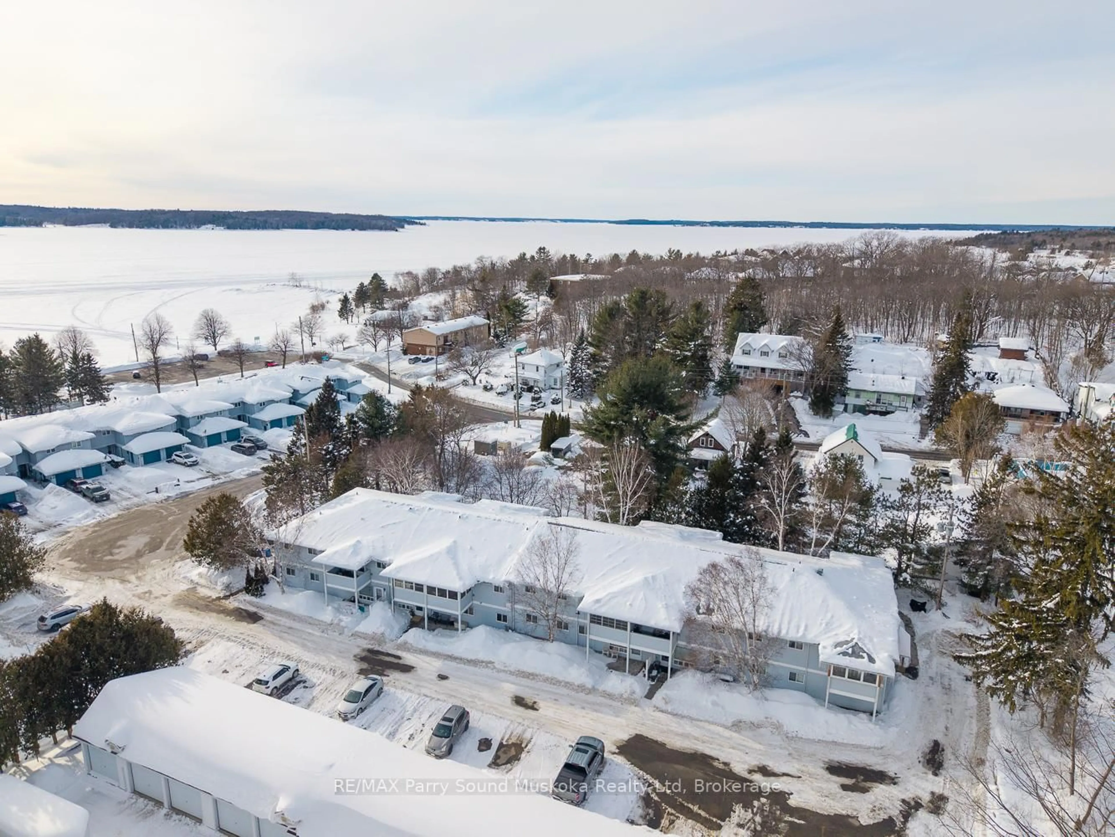 A pic from outside/outdoor area/front of a property/back of a property/a pic from drone, water/lake/river/ocean view for 1 Georgian Bay Ave #105, Parry Sound Ontario P2A 3B1