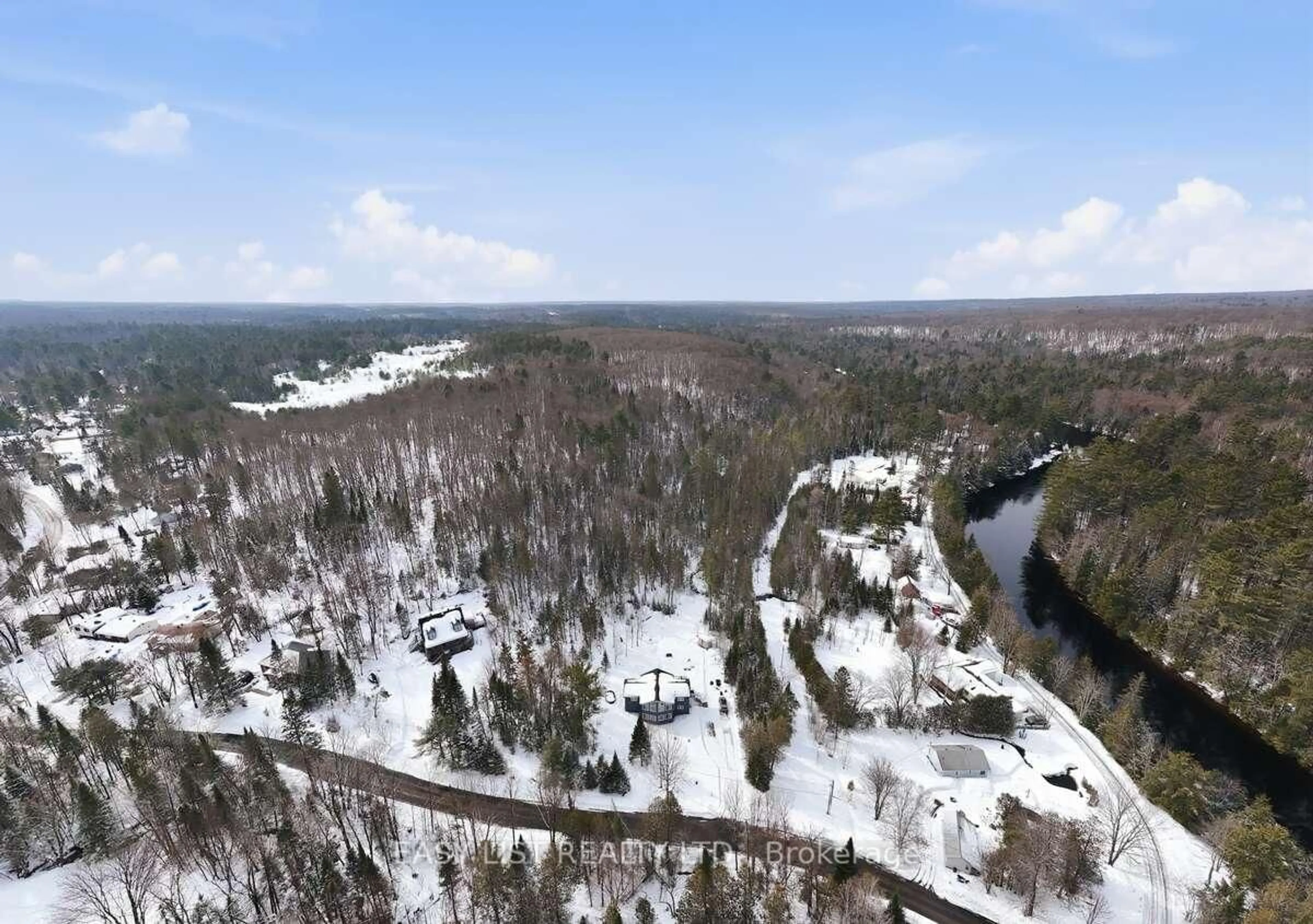 A pic from outside/outdoor area/front of a property/back of a property/a pic from drone, forest/trees view for 1131 Springdale Park Rd, Bracebridge Ontario P1L 1W9