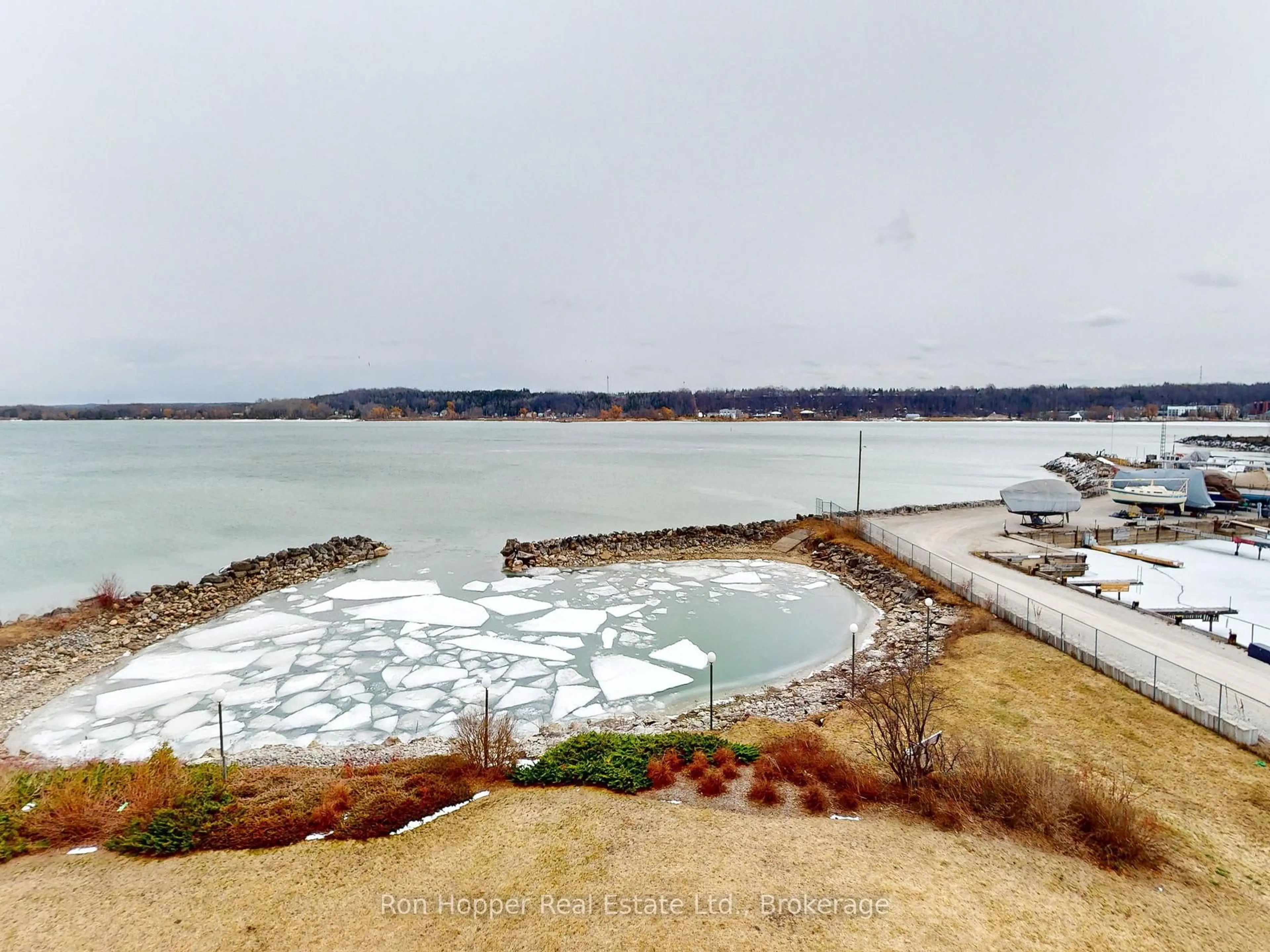 A pic from outside/outdoor area/front of a property/back of a property/a pic from drone, water/lake/river/ocean view for 2555 3rd Ave #303, Owen Sound Ontario N4K 6T8
