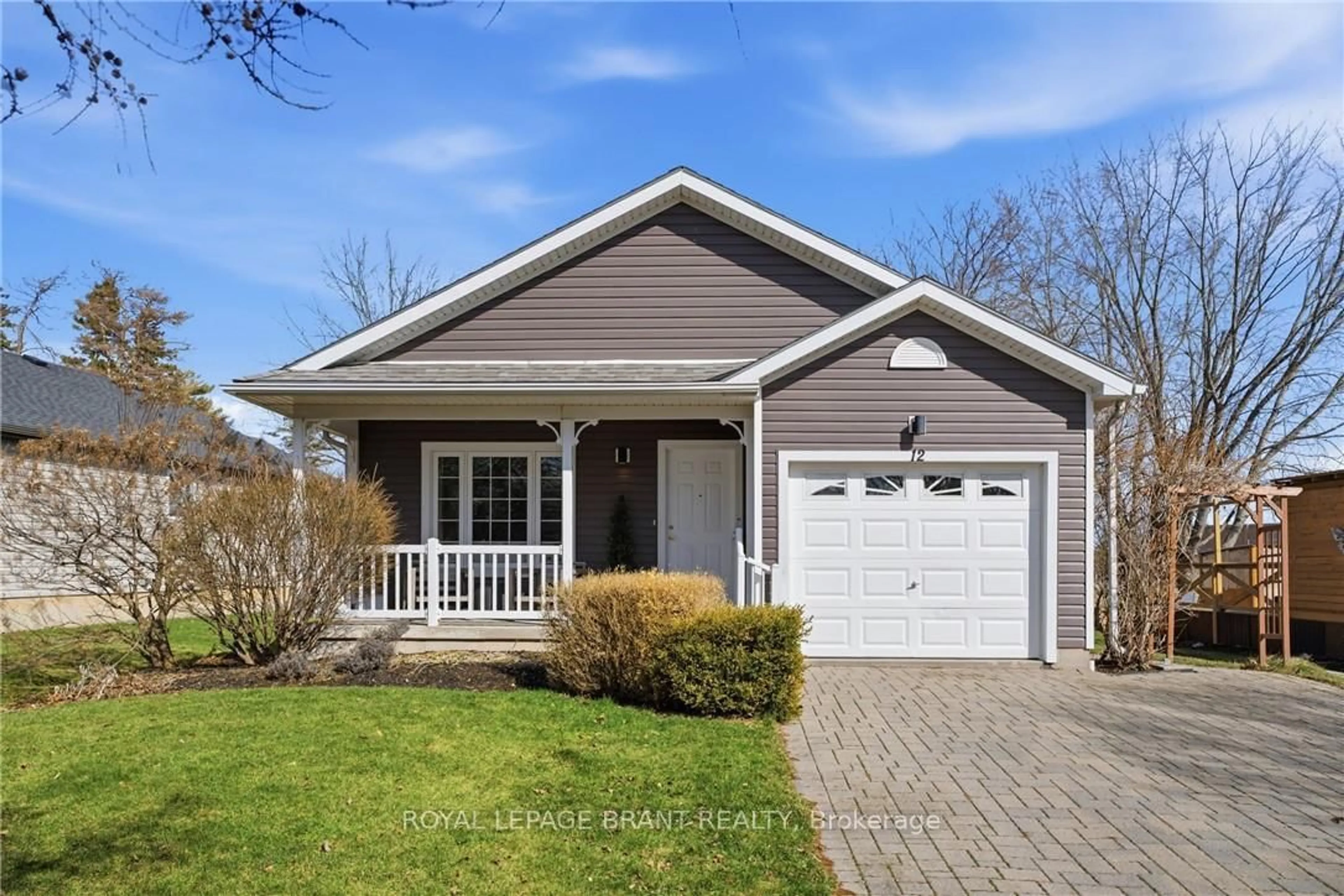 Home with vinyl exterior material, street for 12 Denby Rd, Norfolk Ontario N0A 1N4