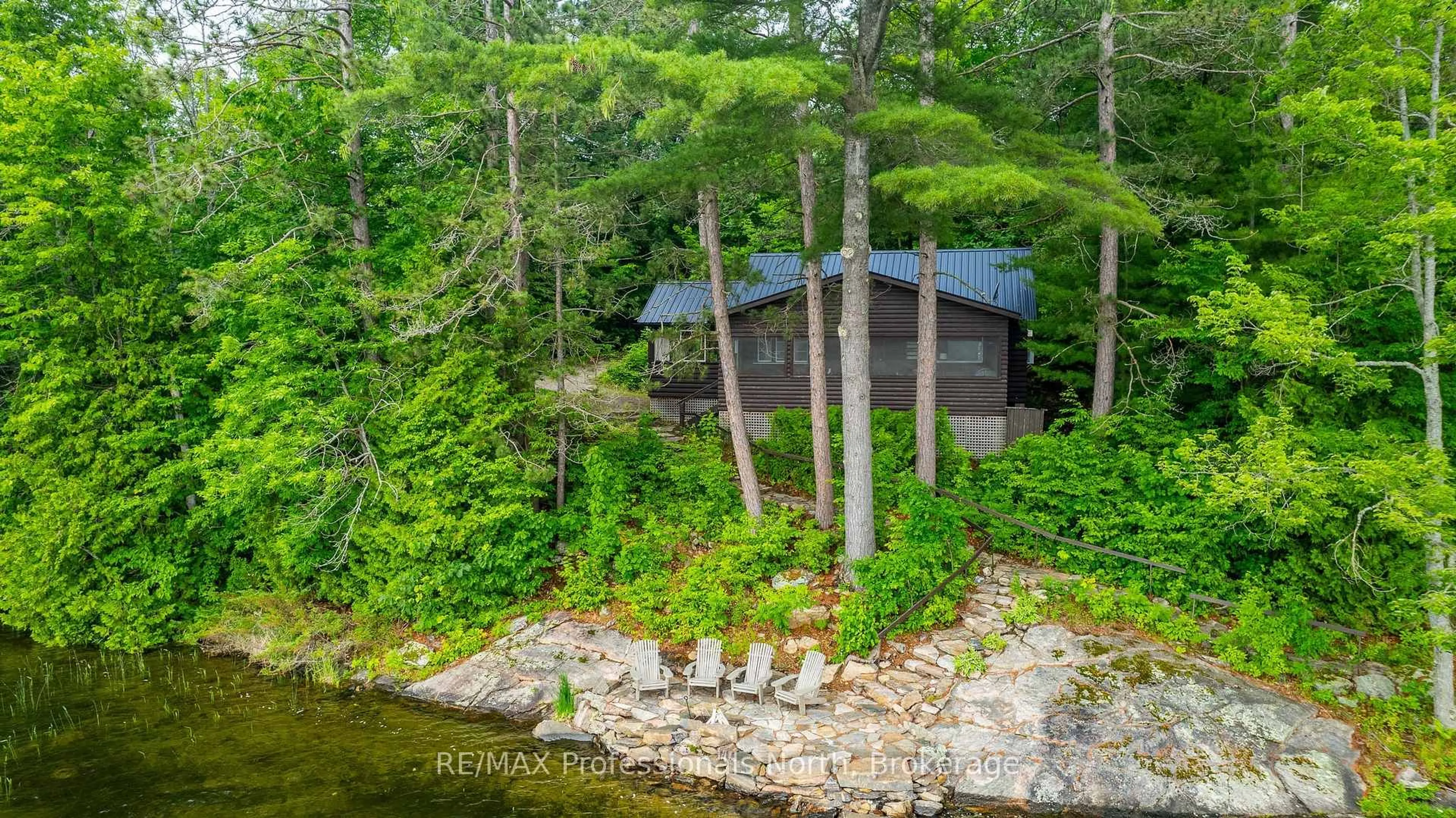 A pic from outside/outdoor area/front of a property/back of a property/a pic from drone, water/lake/river/ocean view for 1030 SCHAEFER'S Rd, Minden Hills Ontario K0M 2K0
