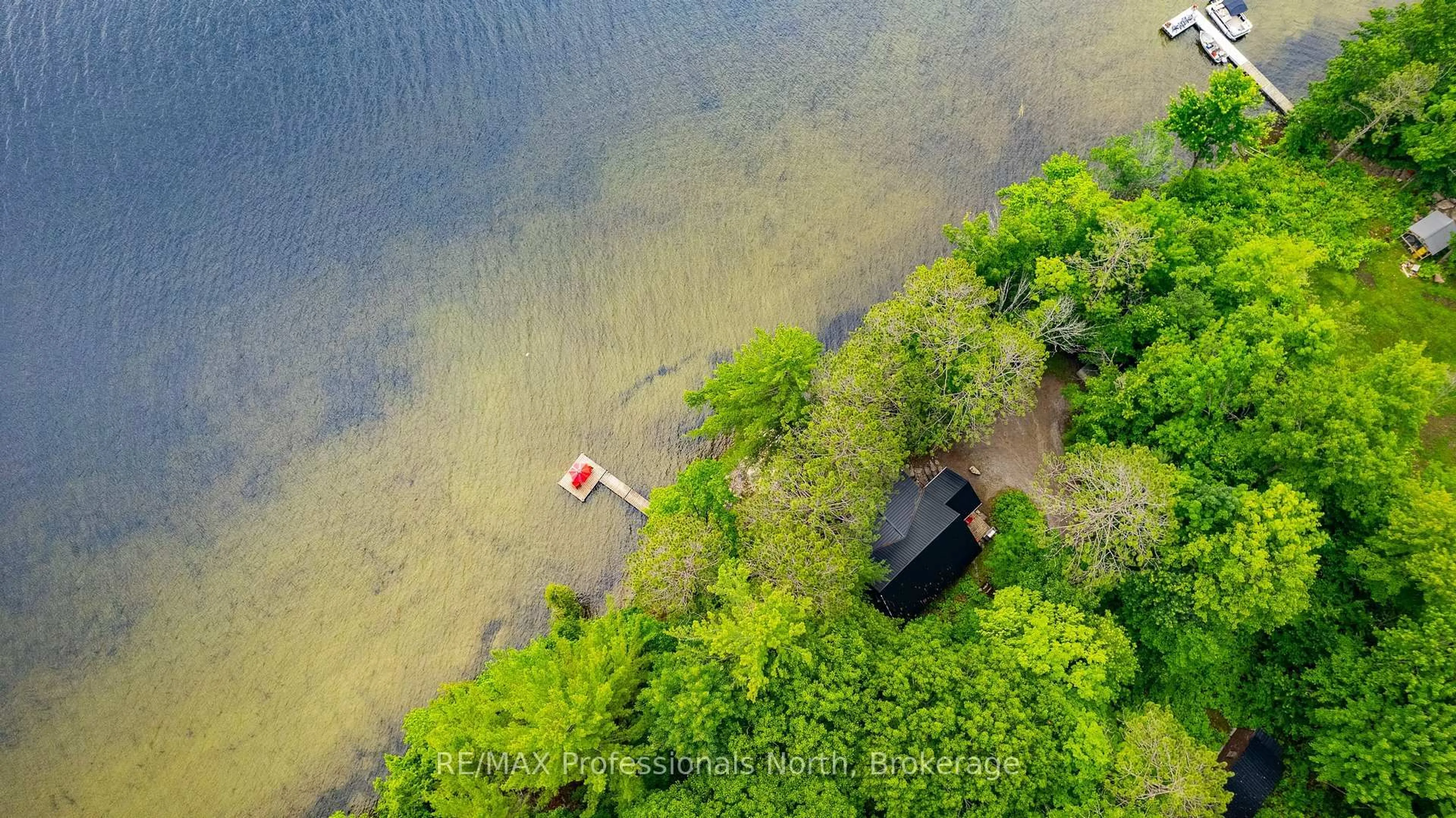 A pic from outside/outdoor area/front of a property/back of a property/a pic from drone, water/lake/river/ocean view for 1030 SCHAEFER'S Rd, Minden Hills Ontario K0M 2K0