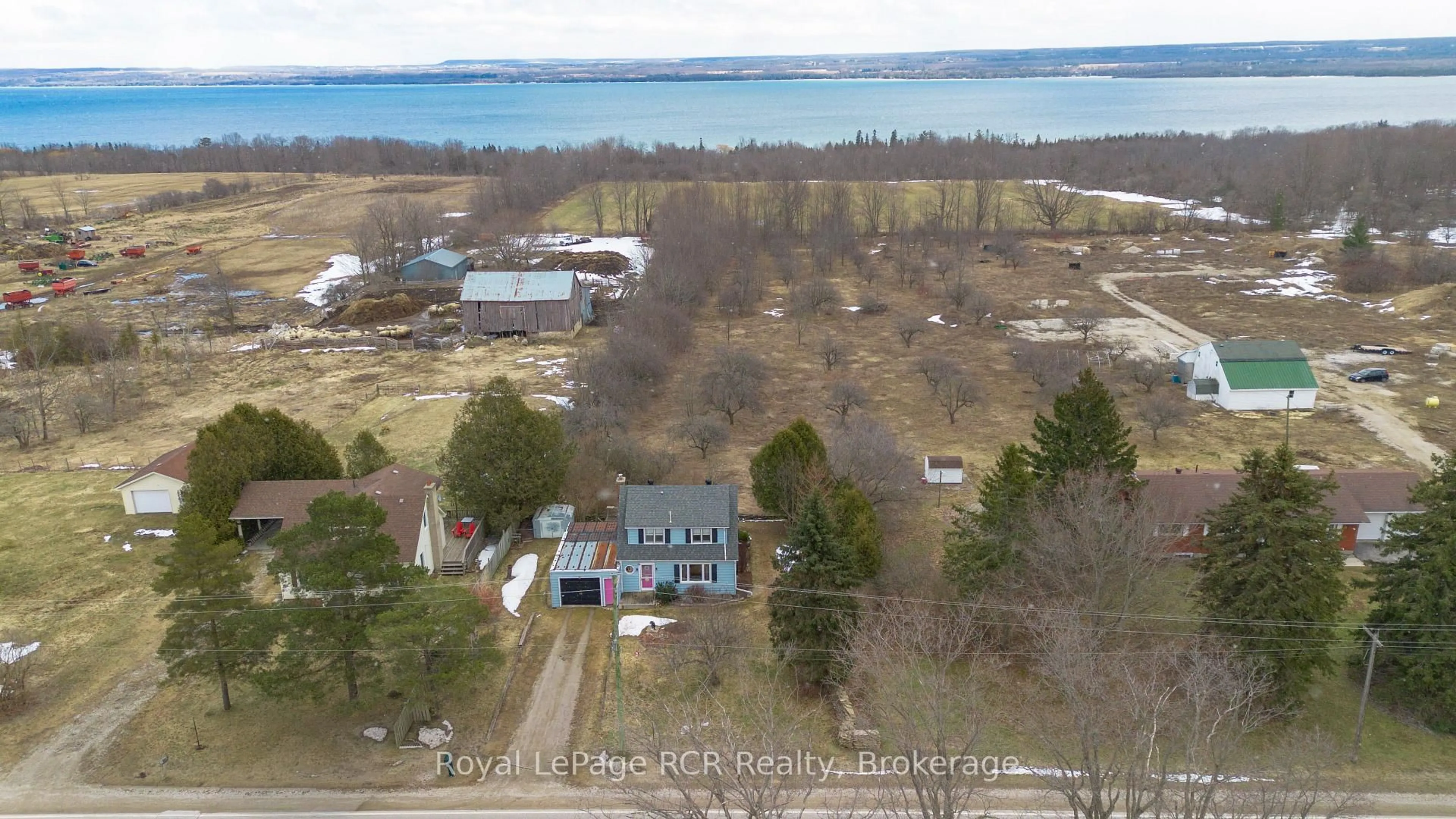 A pic from outside/outdoor area/front of a property/back of a property/a pic from drone, water/lake/river/ocean view for 318869 Grey Road 1 Rd, Georgian Bluffs Ontario N4K 5N4