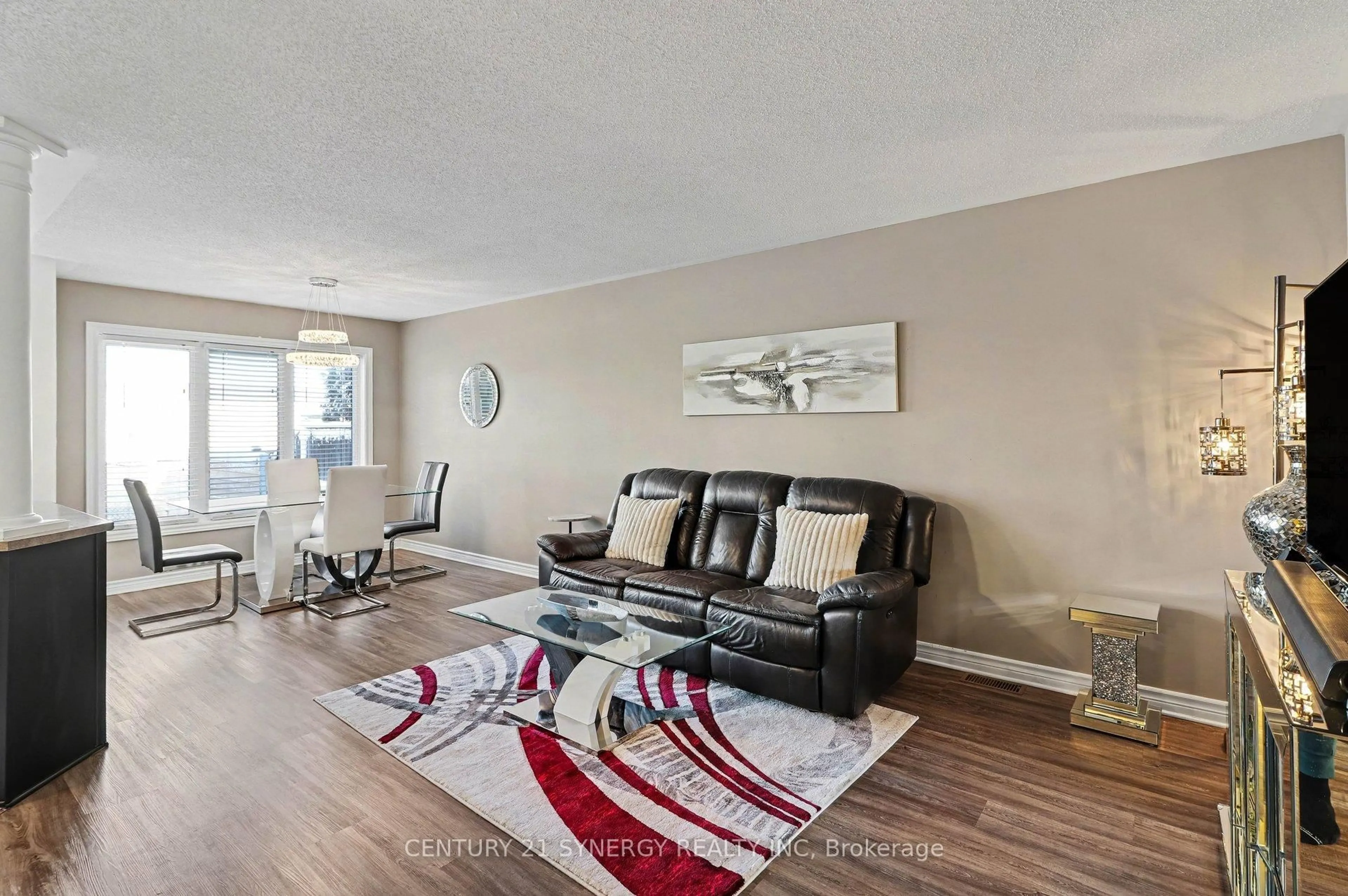 Living room with furniture, wood/laminate floor for 114 Silvermoon Cres, Ottawa Ontario K4A 0P9