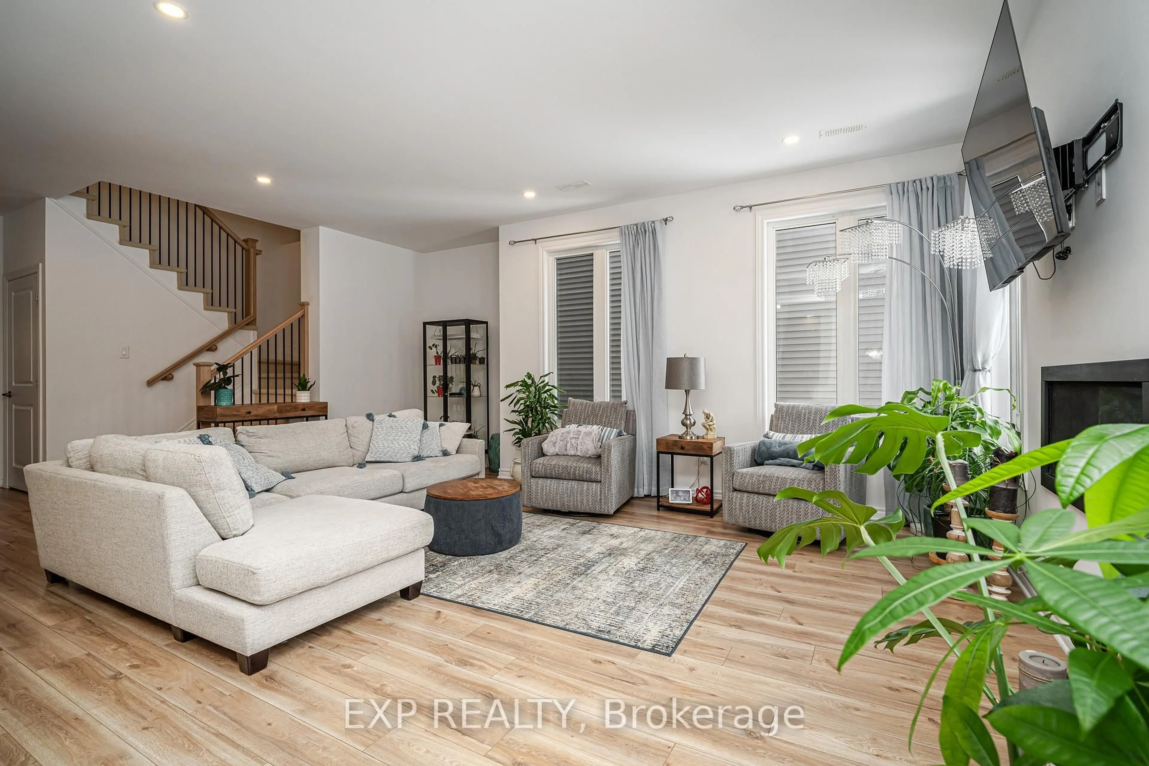 Living room with furniture, wood/laminate floor for 99 Dun Skipper Dr, Ottawa Ontario K1X 0G1