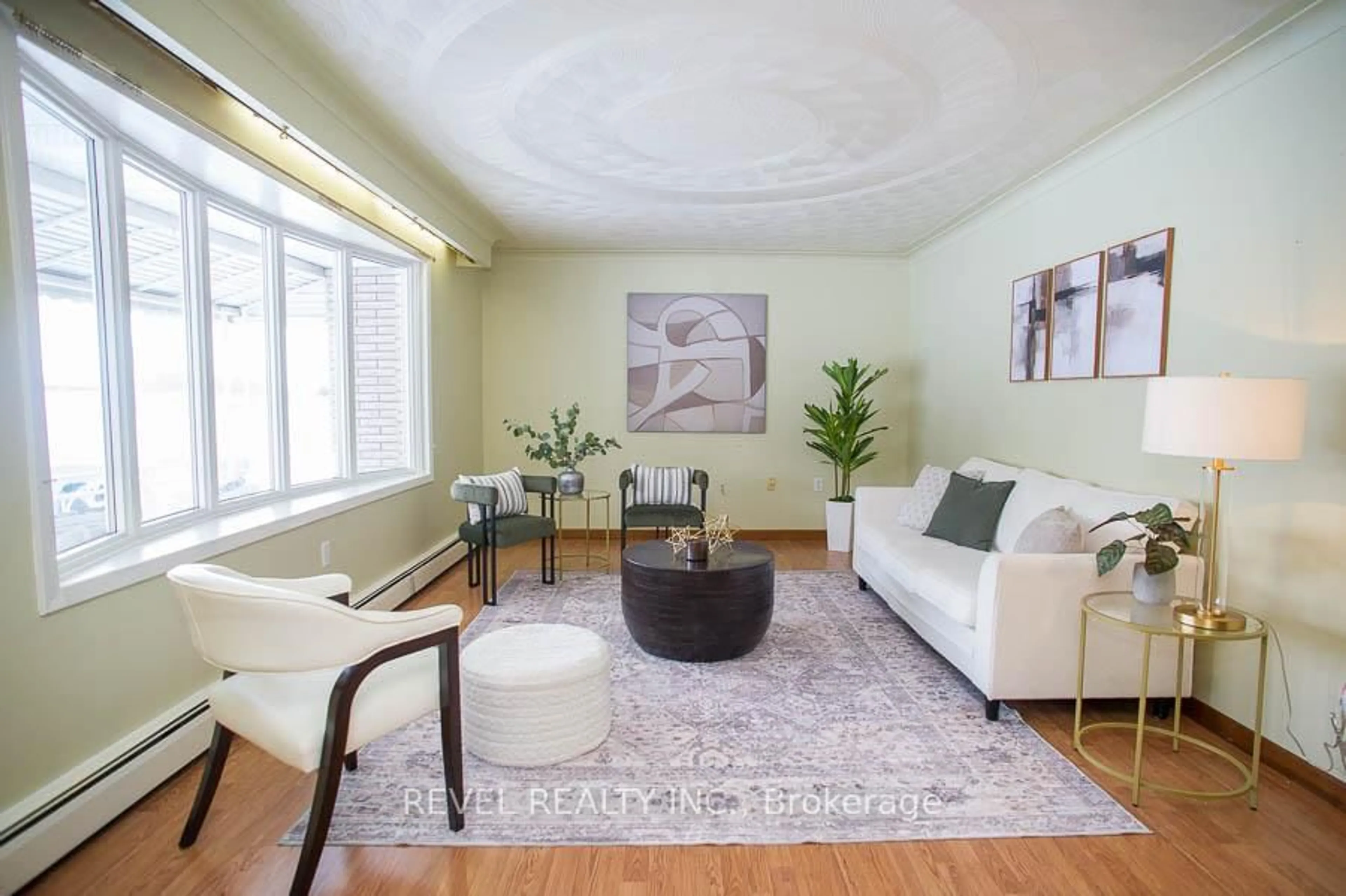 Living room with furniture, wood/laminate floor for 104 Hillside Ave, Norfolk Ontario N4B 1Y7