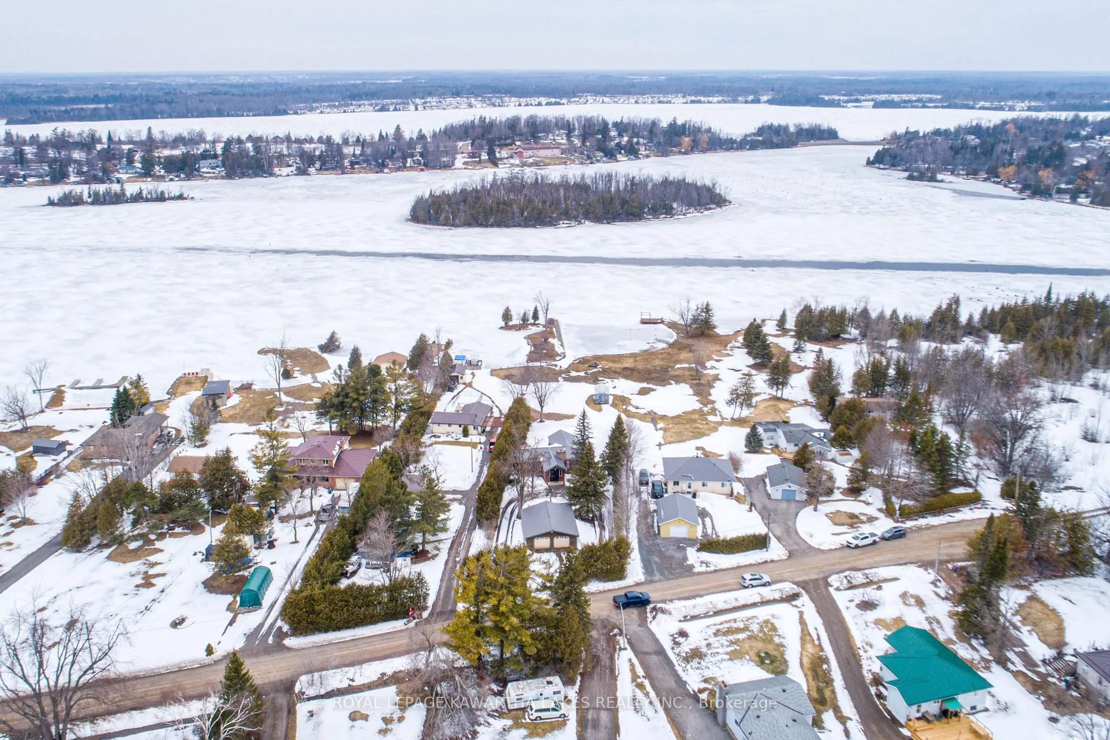A pic from outside/outdoor area/front of a property/back of a property/a pic from drone, water/lake/river/ocean view for 63 Robinson Ave, Kawartha Lakes Ontario K0M 2B0