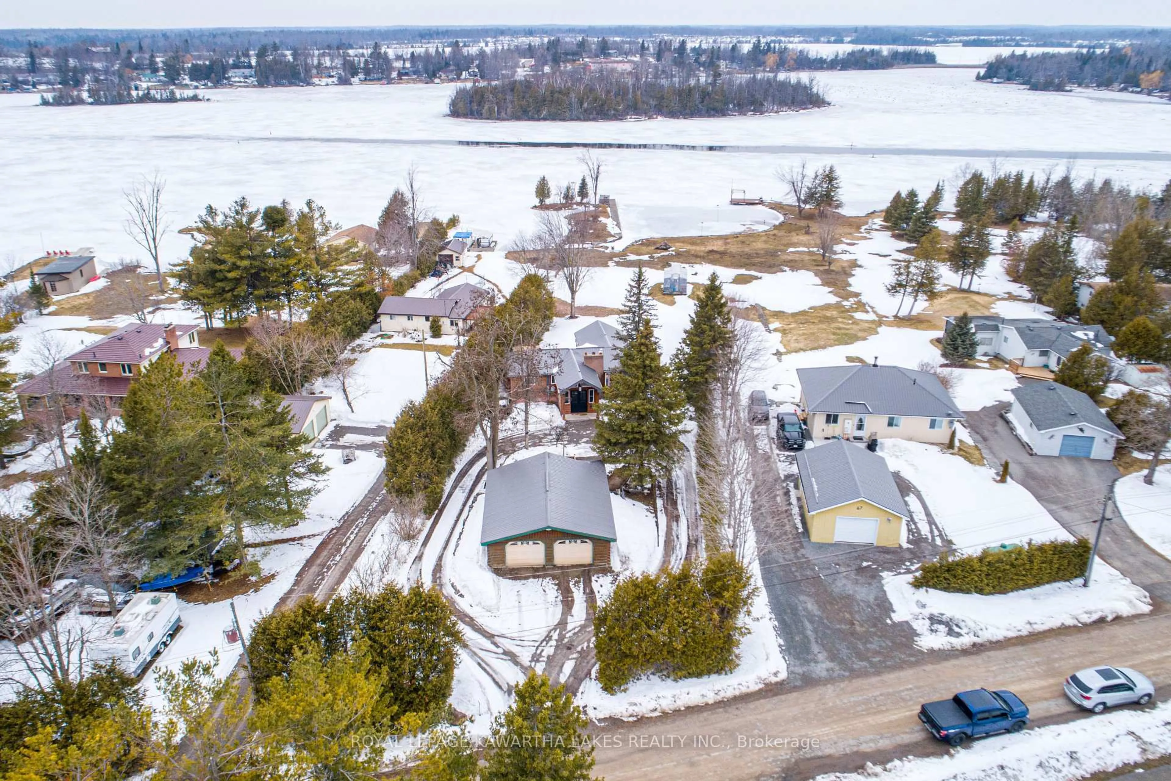A pic from outside/outdoor area/front of a property/back of a property/a pic from drone, water/lake/river/ocean view for 63 Robinson Ave, Kawartha Lakes Ontario K0M 2B0