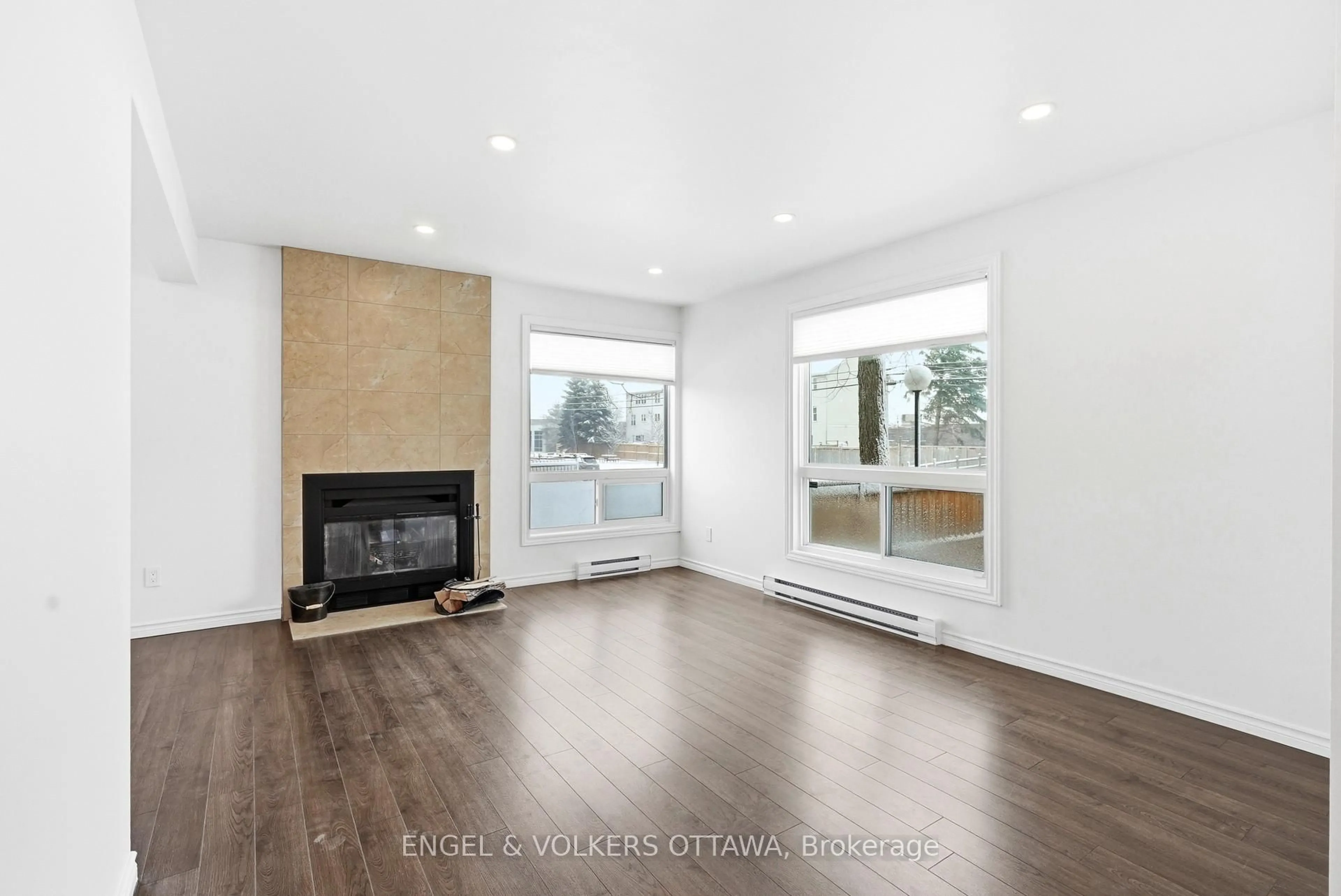 Living room with furniture, wood/laminate floor for 311 Presland Rd #10, Ottawa Ontario K1K 2B6