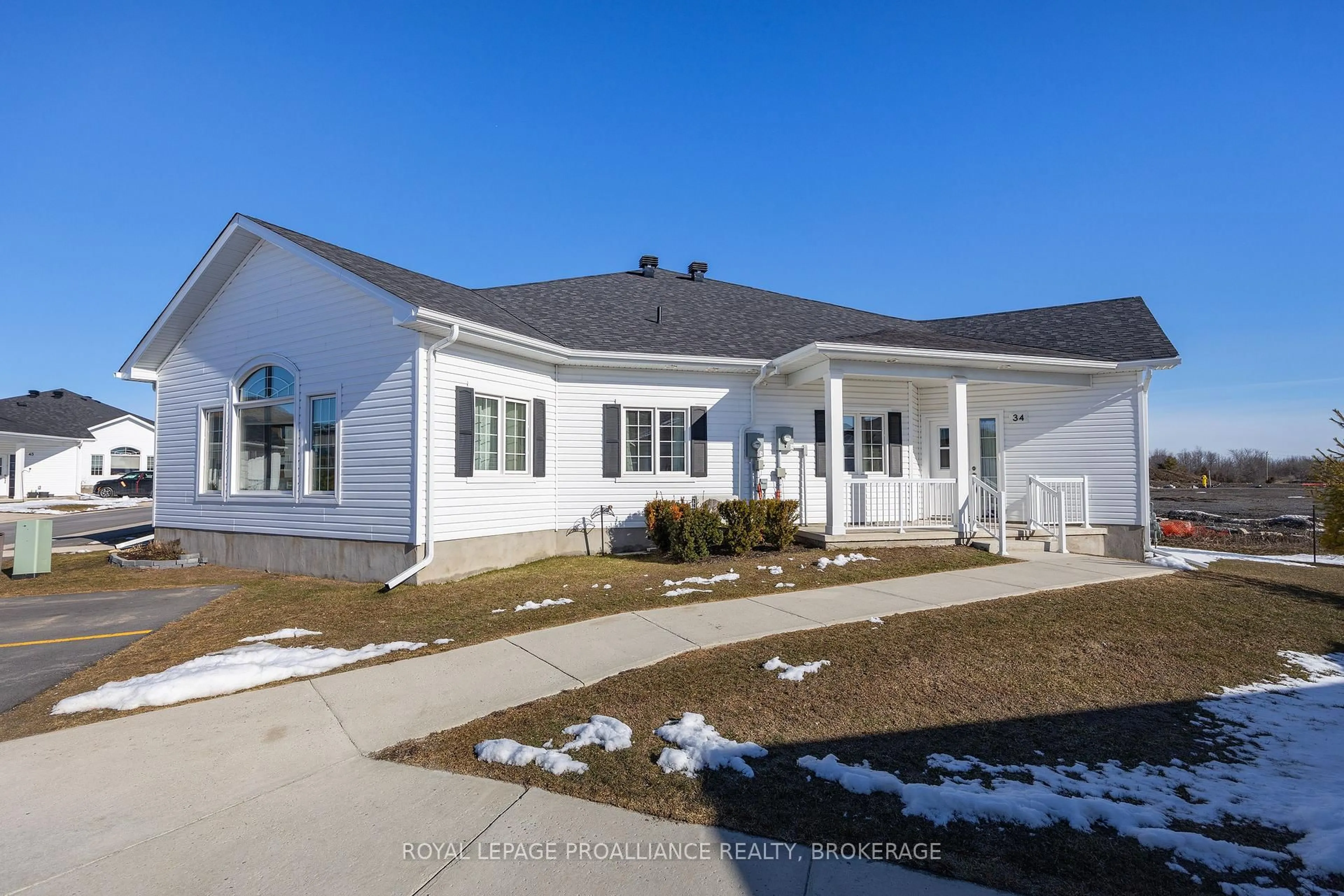 Home with vinyl exterior material, street for 34 Lowry Pl #49, Loyalist Ontario K7N 1R5