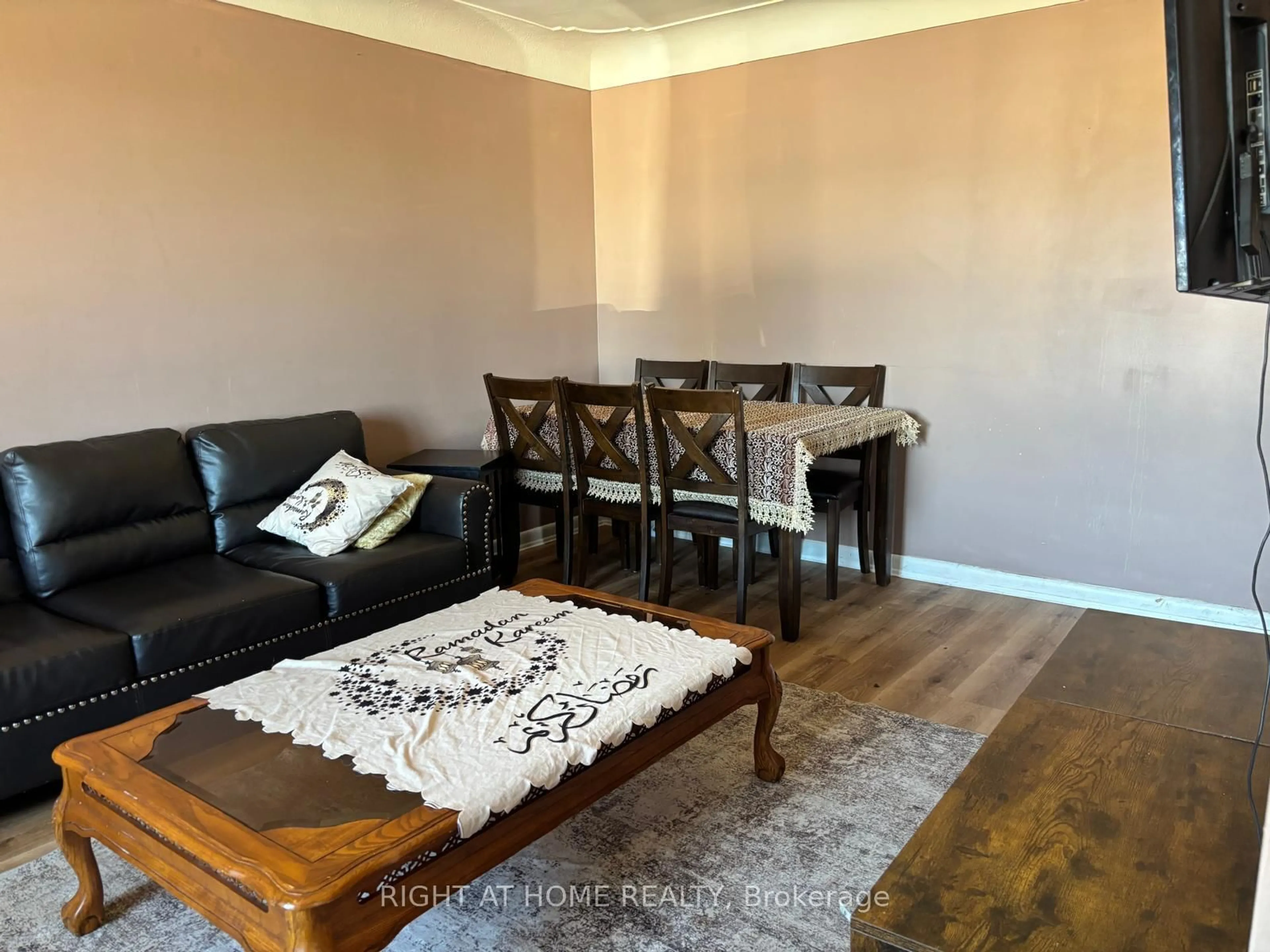 Living room with furniture, wood/laminate floor for 1224 Dunsmure Rd, Hamilton Ontario L8H 1L6