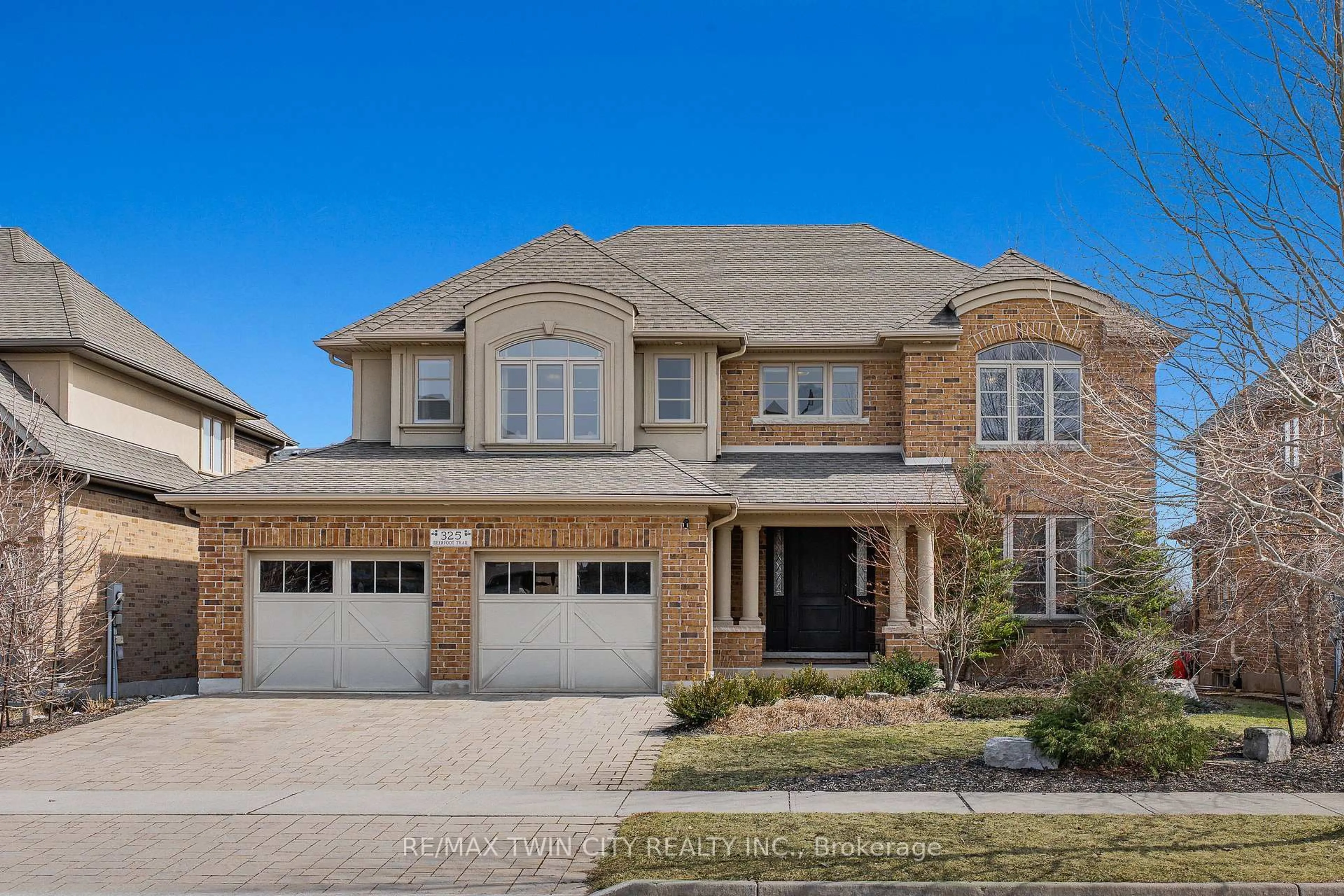 Home with brick exterior material, street for 325 Deerfoot Tr, Waterloo Ontario N2K 0B4