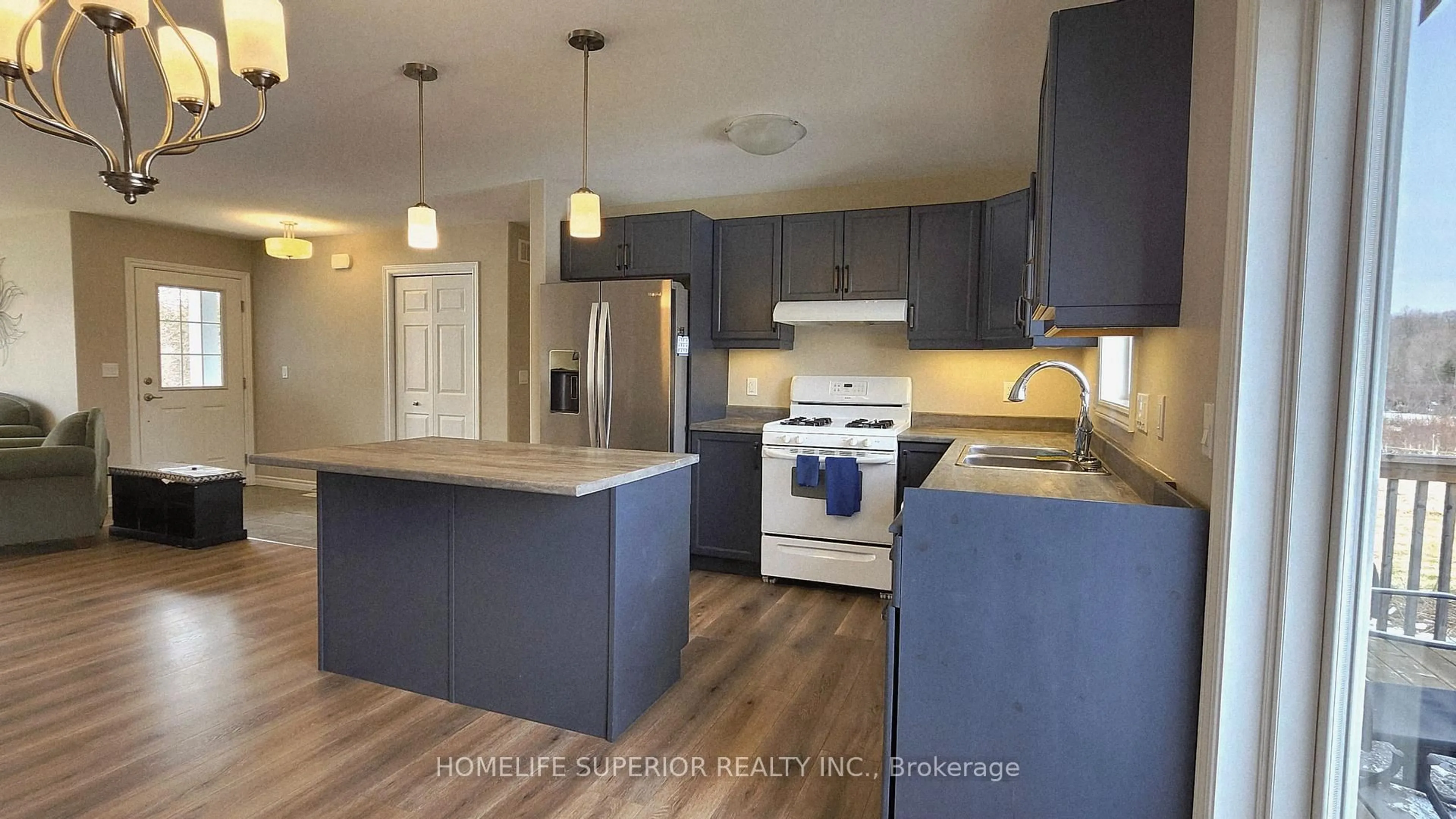 Open concept kitchen, wood/laminate floor for 307 Tracey Rd, Belleville Ontario K0K 2Y0