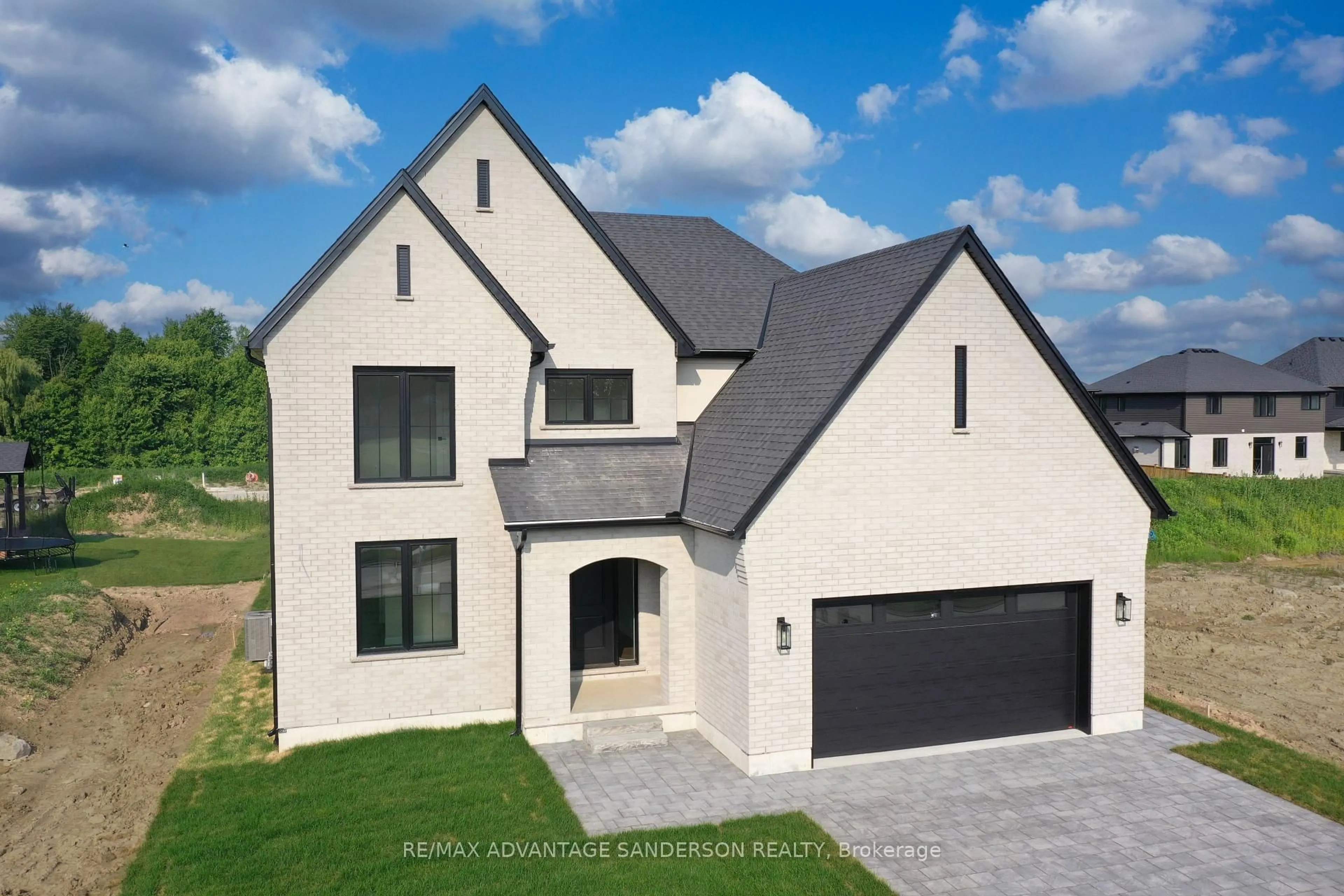 Home with brick exterior material, street for 174 Timberwalk Tr, Middlesex Centre Ontario N0M 2A0