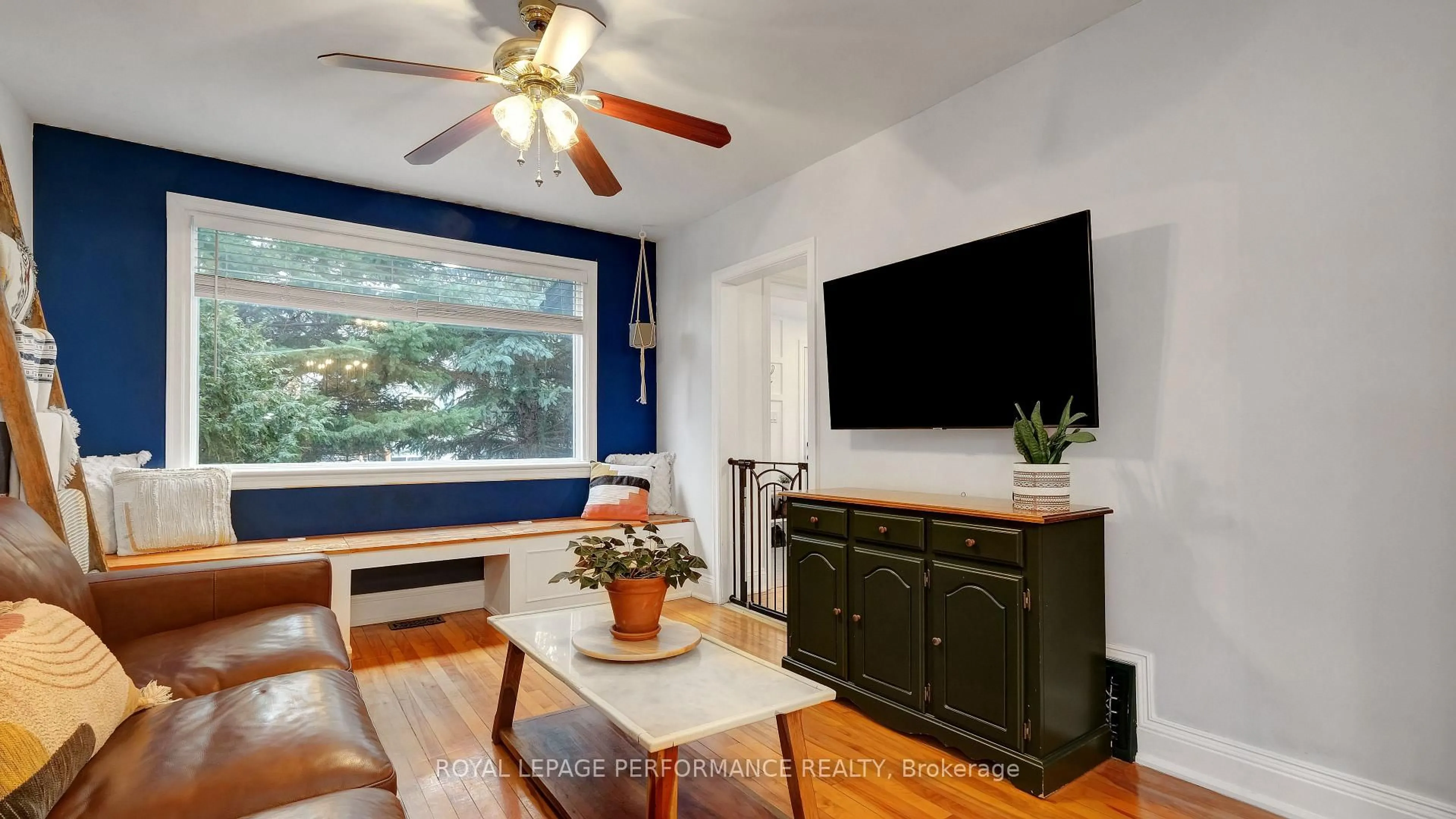 Living room with furniture, wood/laminate floor for 319 Frontenac St, Ottawa Ontario K1L 6K6