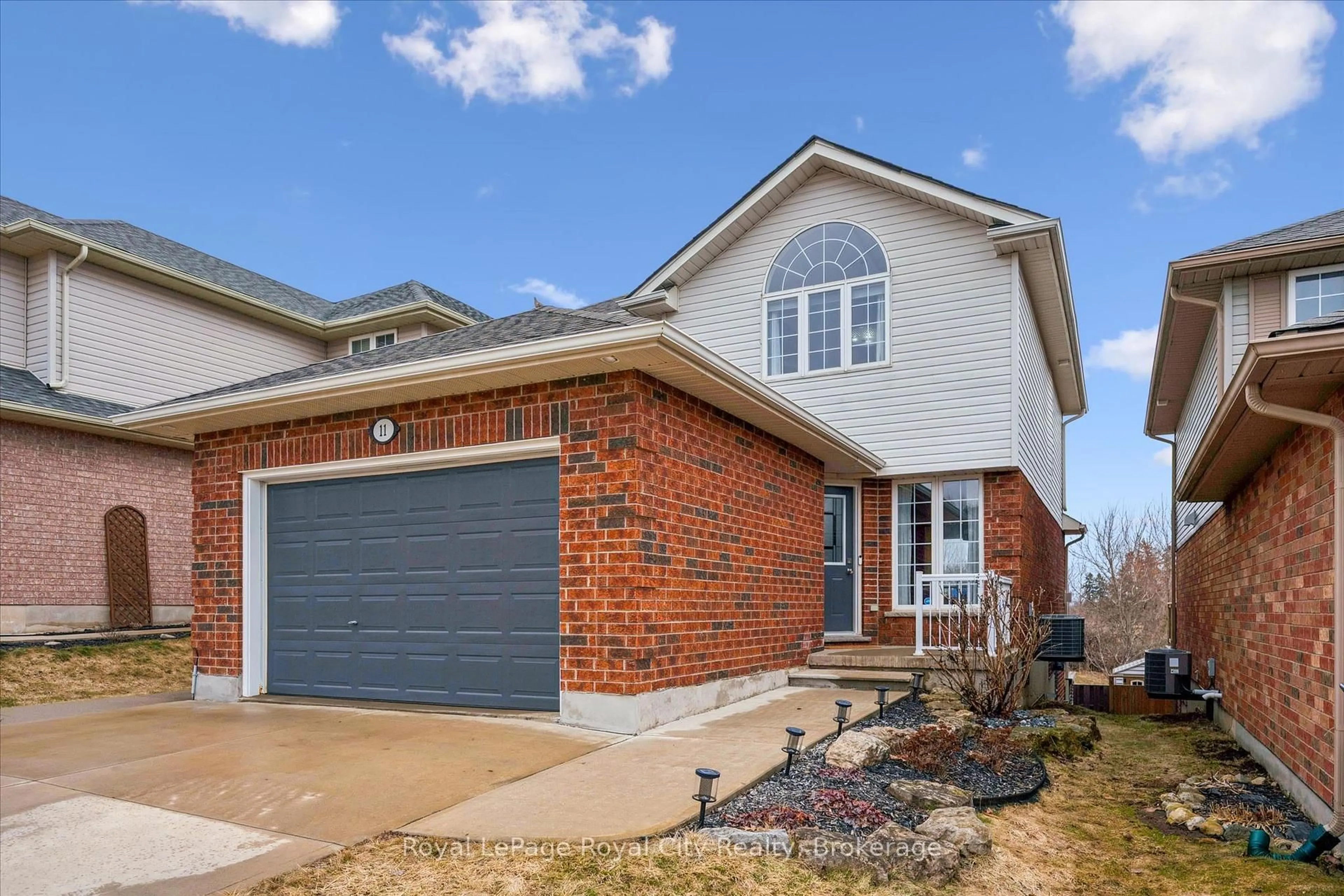 Home with brick exterior material, street for 11 Valleyhaven Lane, Guelph Ontario N1E 0A3