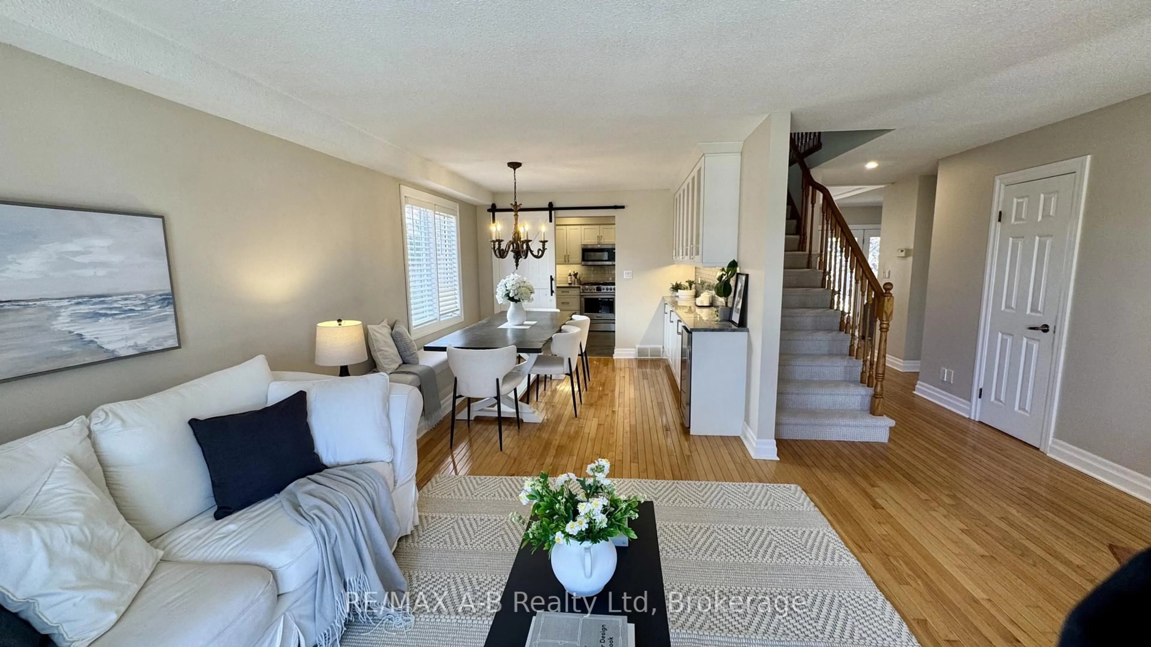 Living room with furniture, wood/laminate floor for 86 Freeland Dr, Stratford Ontario N4Z 1H1