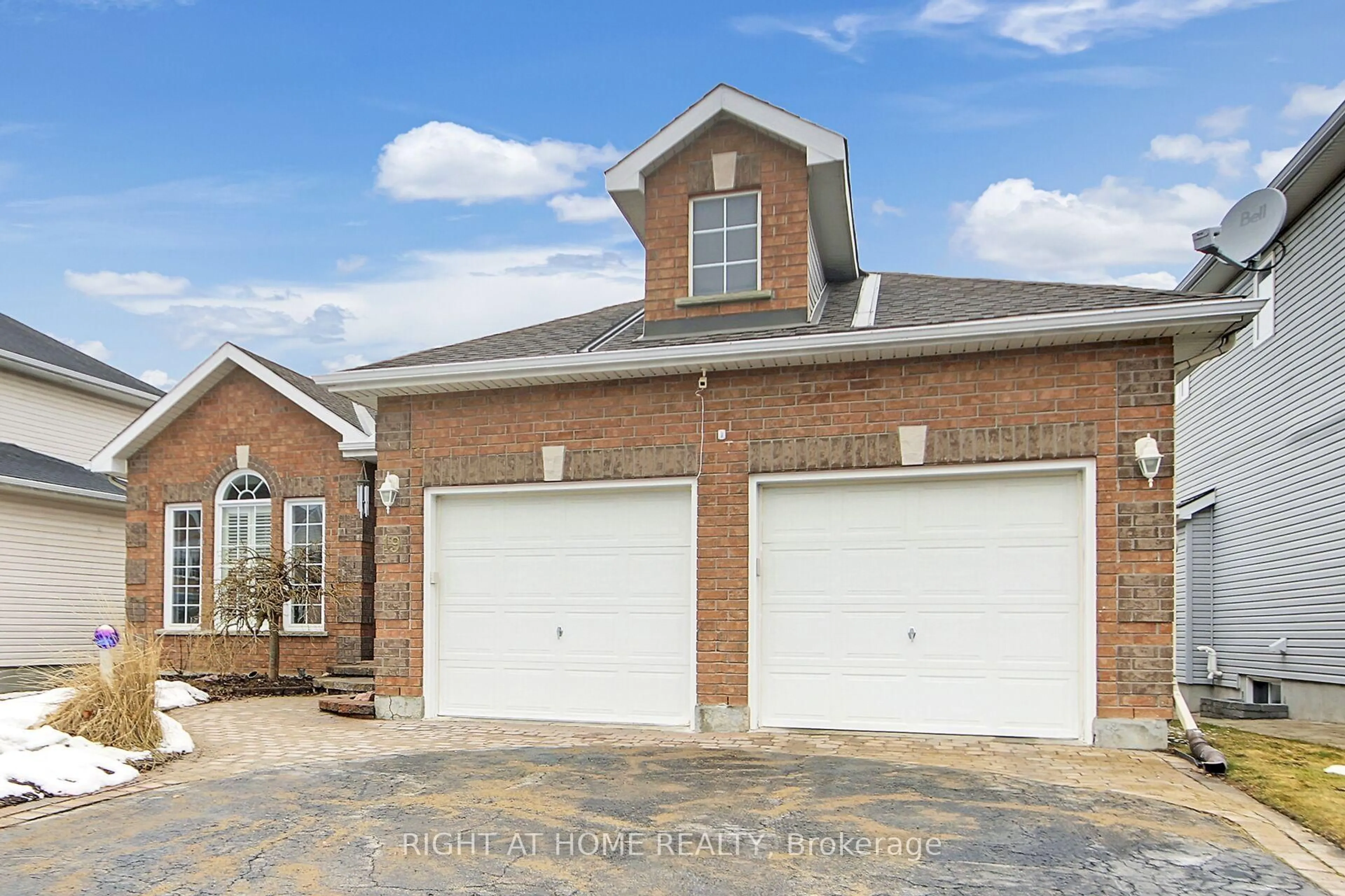 Home with brick exterior material, street for 19 Cinnabar Way, Ottawa Ontario K2S 1Y6