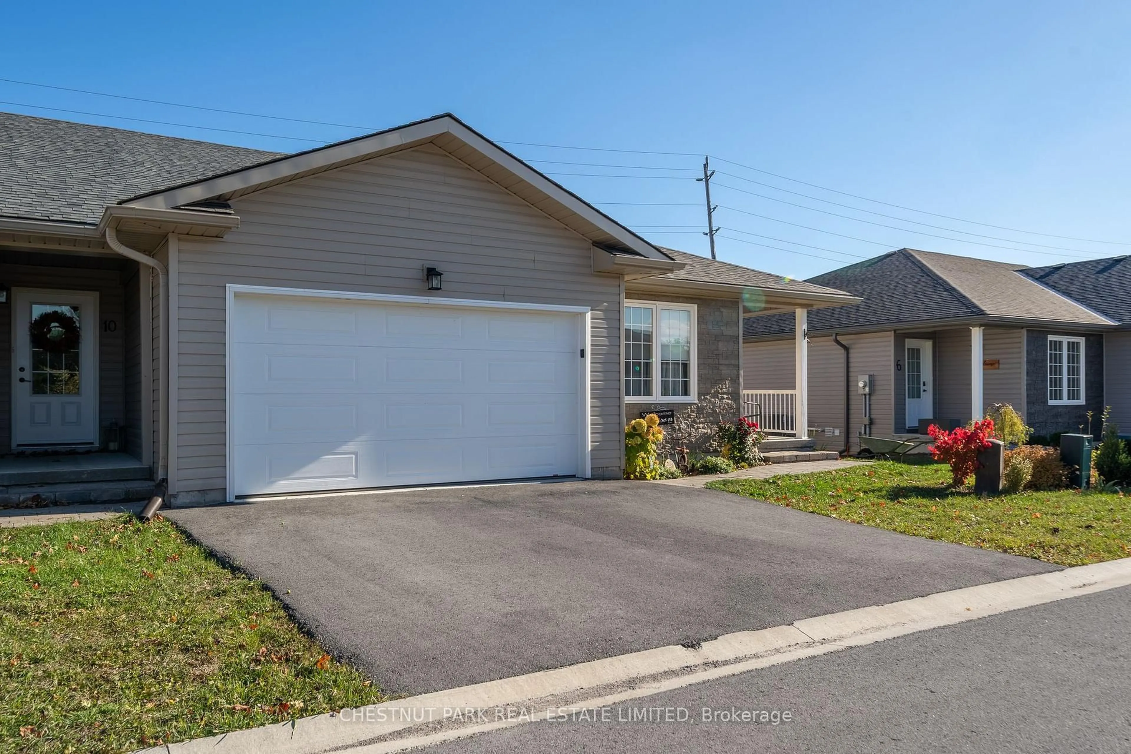 Home with vinyl exterior material, street for 8 Abbott Lane, Prince Edward County Ontario K0K 2T0