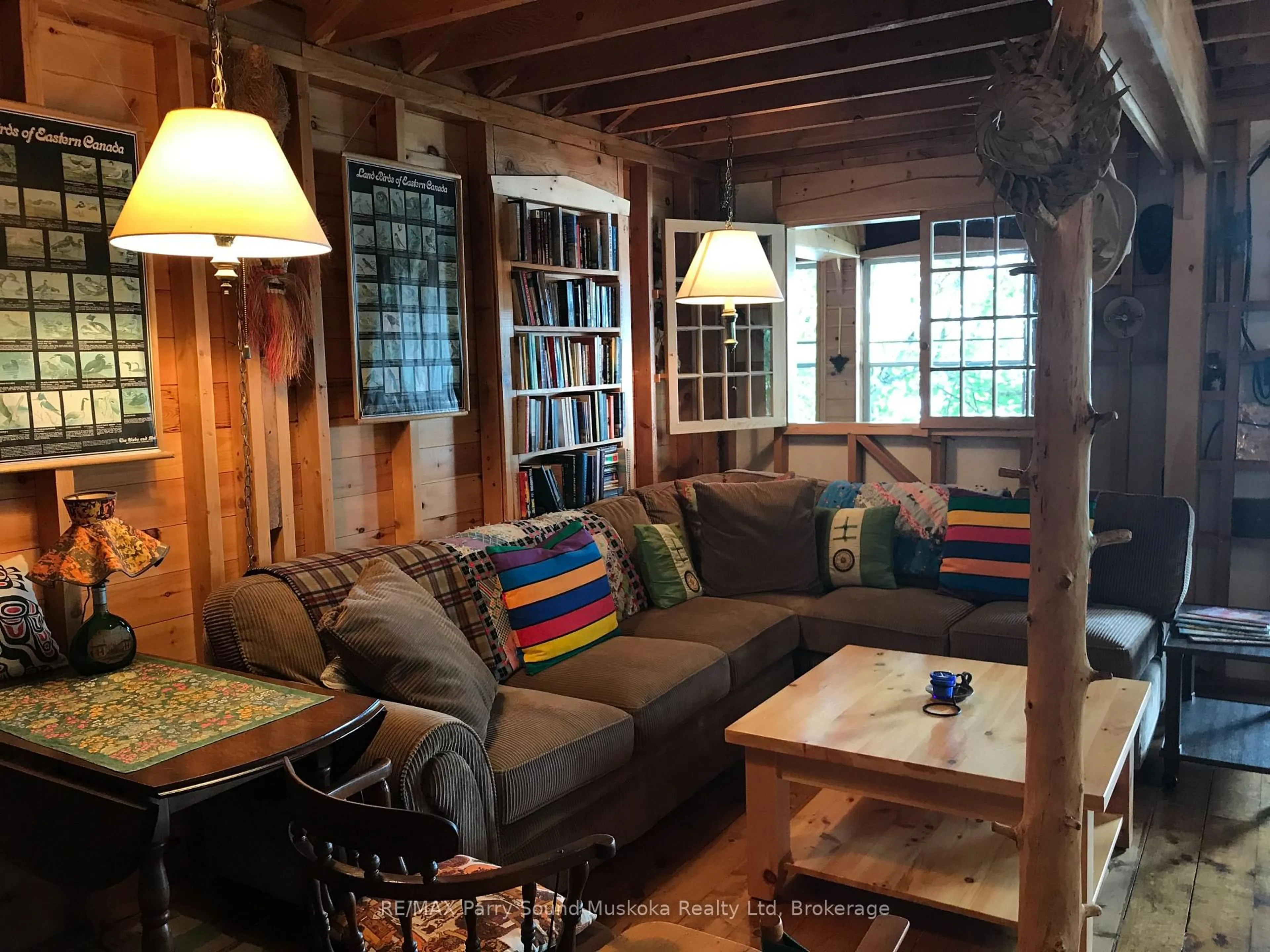 Living room with furniture, wood/laminate floor for 1292 Memesagamesing Lake, Parry Sound Remote Area Ontario P0H 1S0