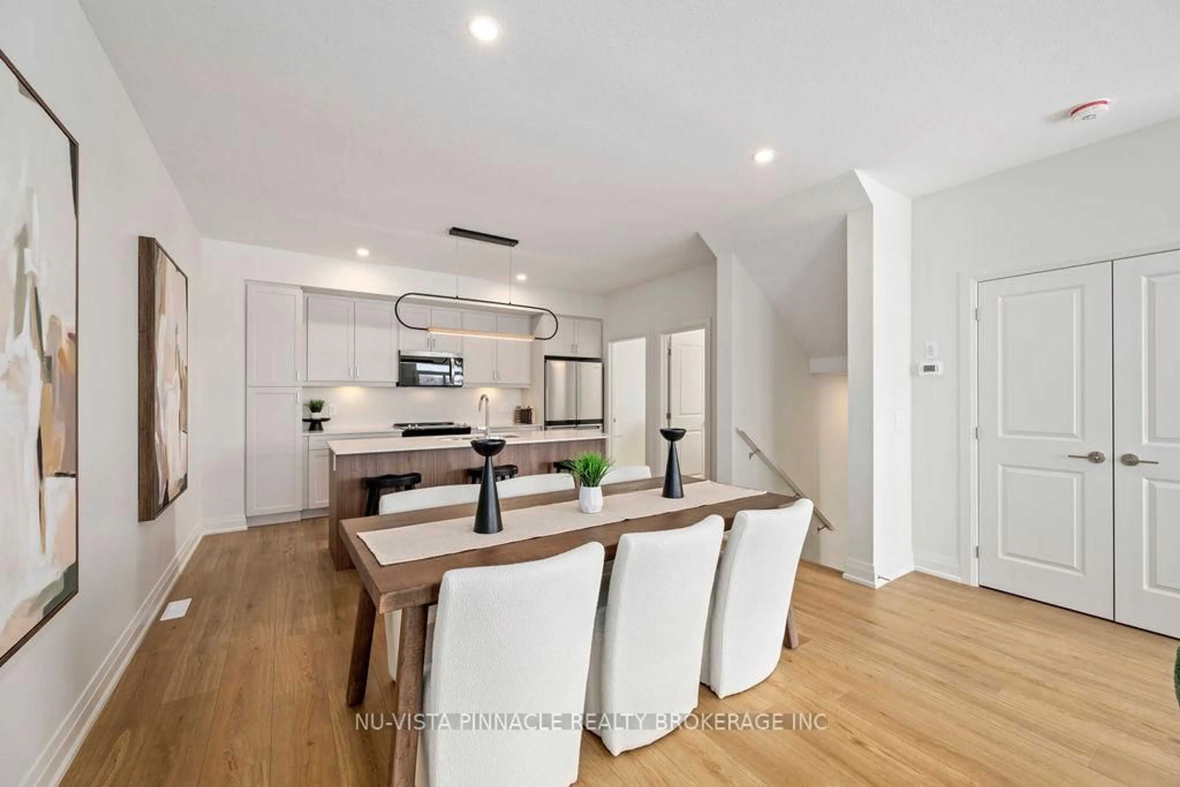 Open concept kitchen, wood/laminate floor for 2605 Kettering Pl #10, London South Ontario N6M 0G4