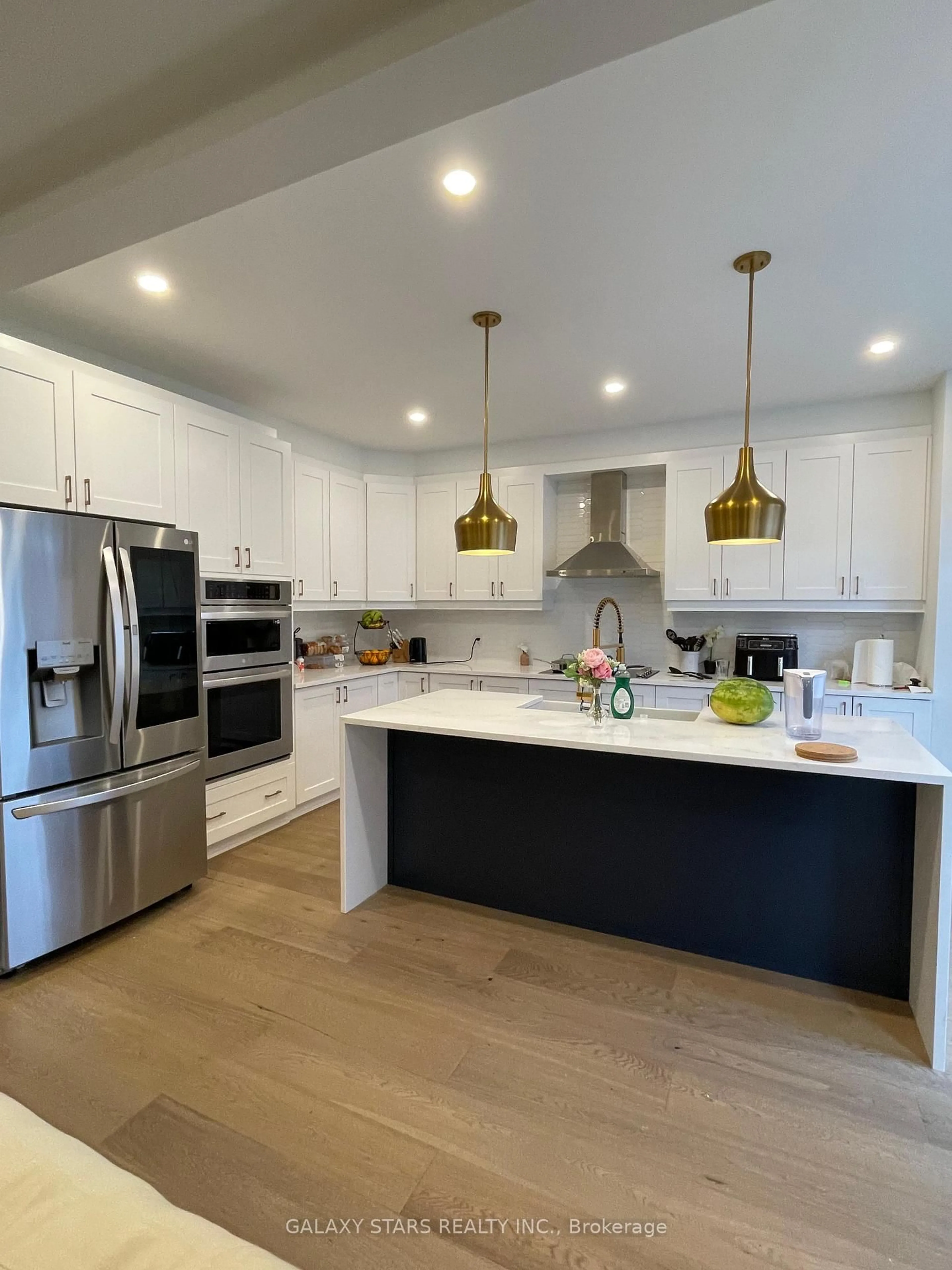 Open concept kitchen, wood/laminate floor for 3482 Greenbank Rd, Ottawa Ontario K2J 0W5