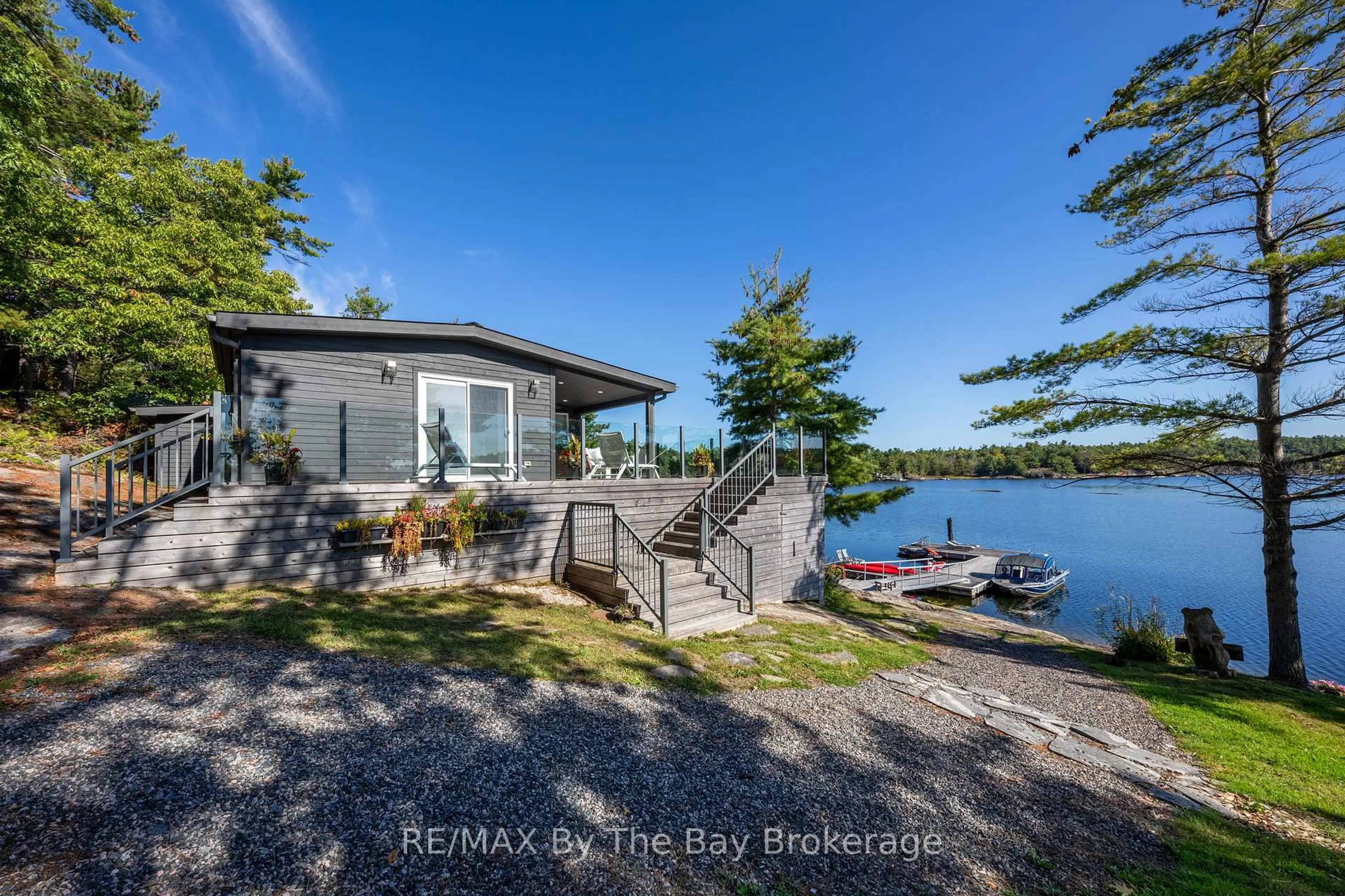 A pic from outside/outdoor area/front of a property/back of a property/a pic from drone, water/lake/river/ocean view for 18152 Georgian Bay Shore, Georgian Bay Ontario P0E 1E0