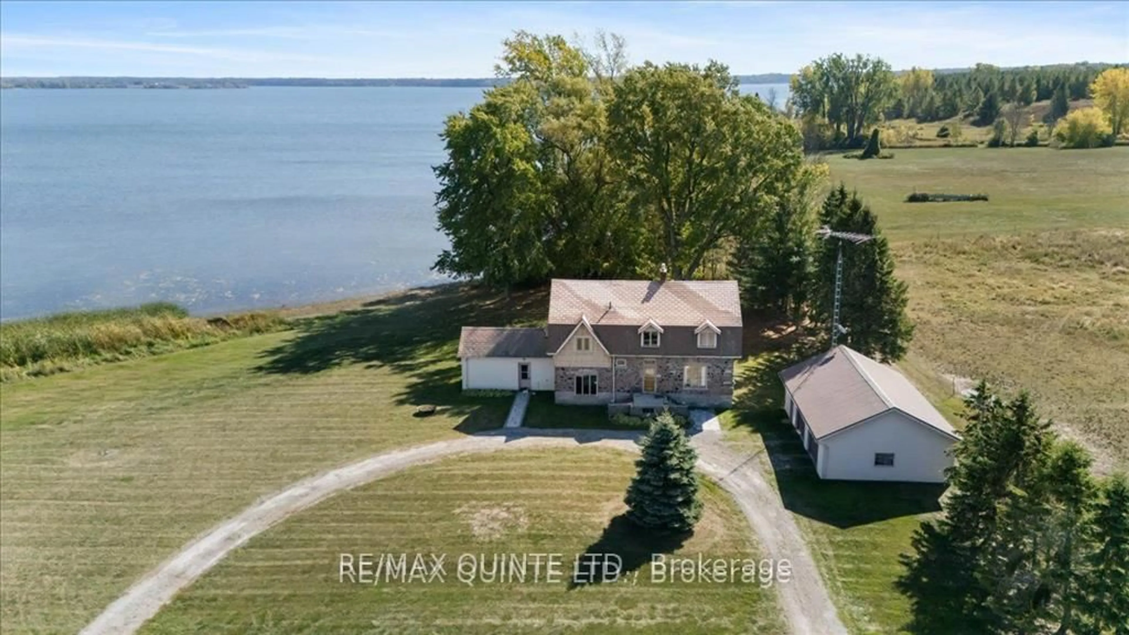 A pic from outside/outdoor area/front of a property/back of a property/a pic from drone, water/lake/river/ocean view for 1120 Huffs Island Rd, Prince Edward County Ontario K8N 4Z7
