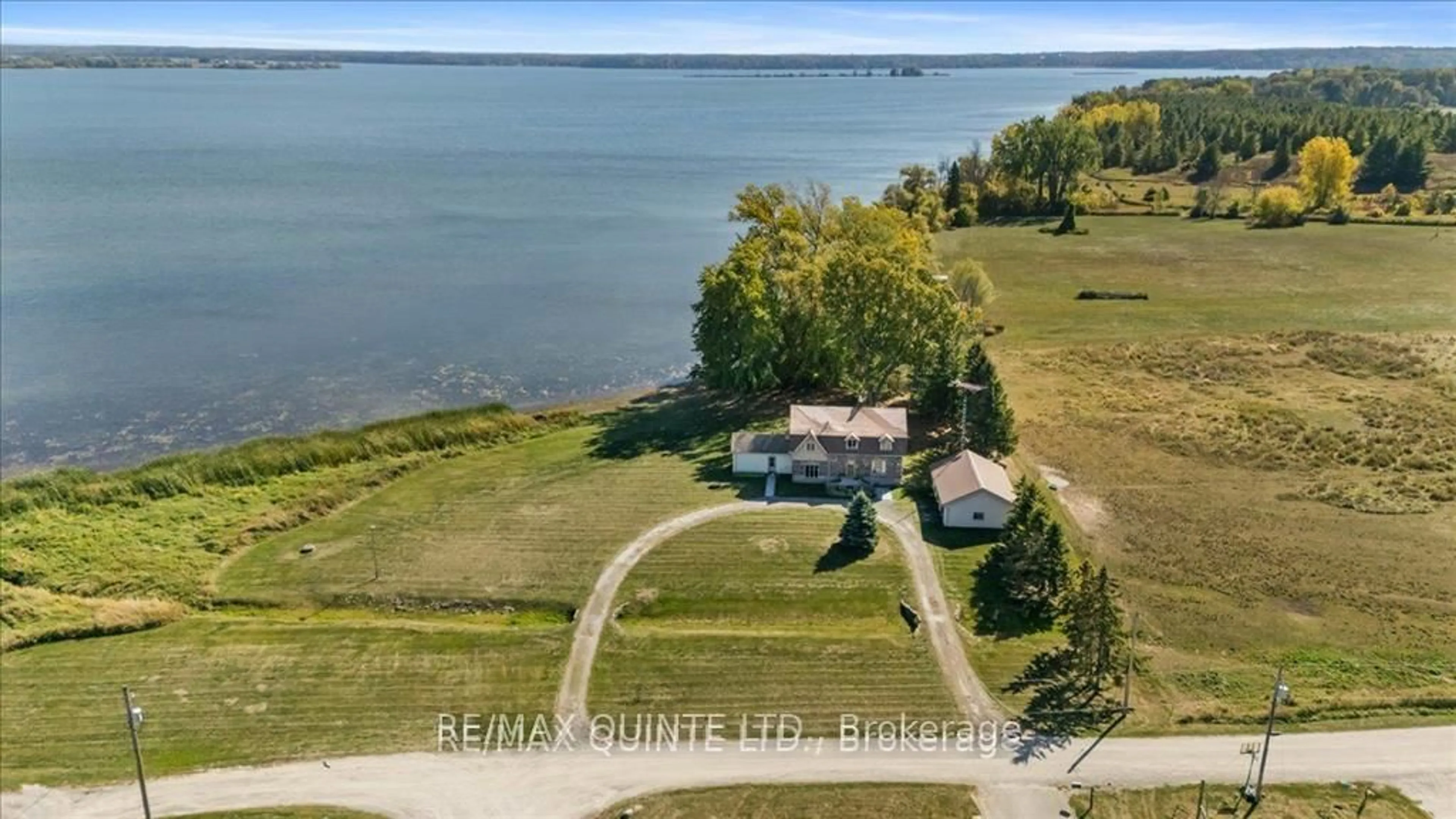 A pic from outside/outdoor area/front of a property/back of a property/a pic from drone, water/lake/river/ocean view for 1120 Huffs Island Rd, Prince Edward County Ontario K8N 4Z7