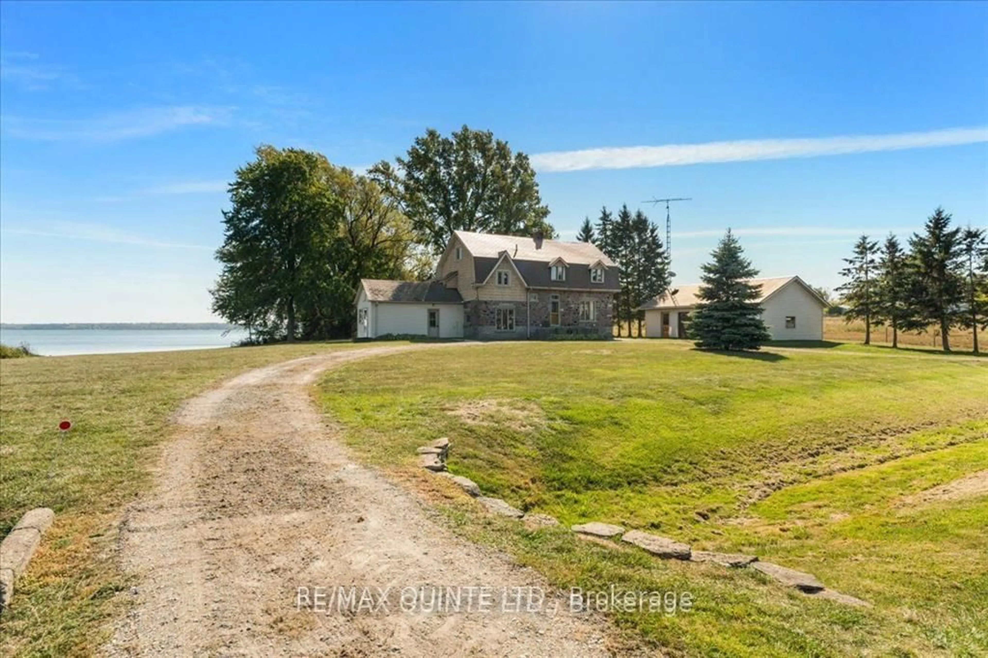 A pic from outside/outdoor area/front of a property/back of a property/a pic from drone, water/lake/river/ocean view for 1120 Huffs Island Rd, Prince Edward County Ontario K8N 4Z7