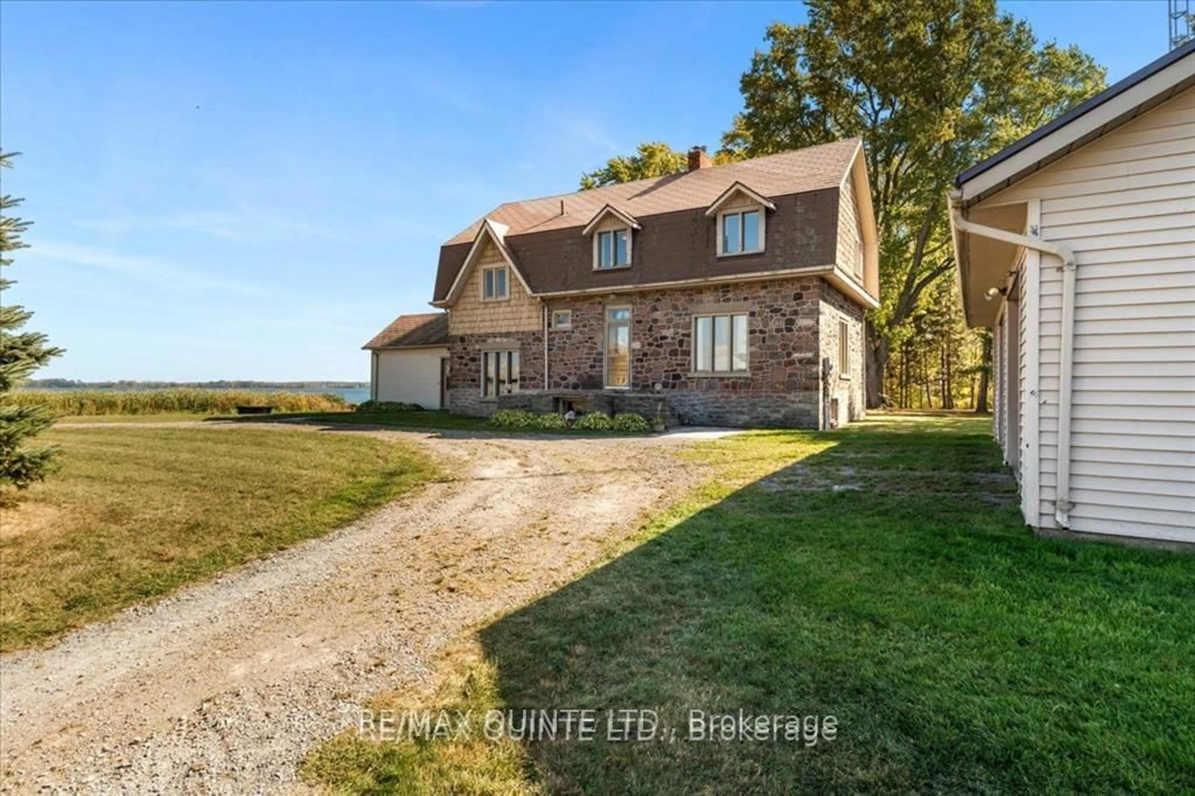 A pic from outside/outdoor area/front of a property/back of a property/a pic from drone, water/lake/river/ocean view for 1120 Huffs Island Rd, Prince Edward County Ontario K8N 4Z7