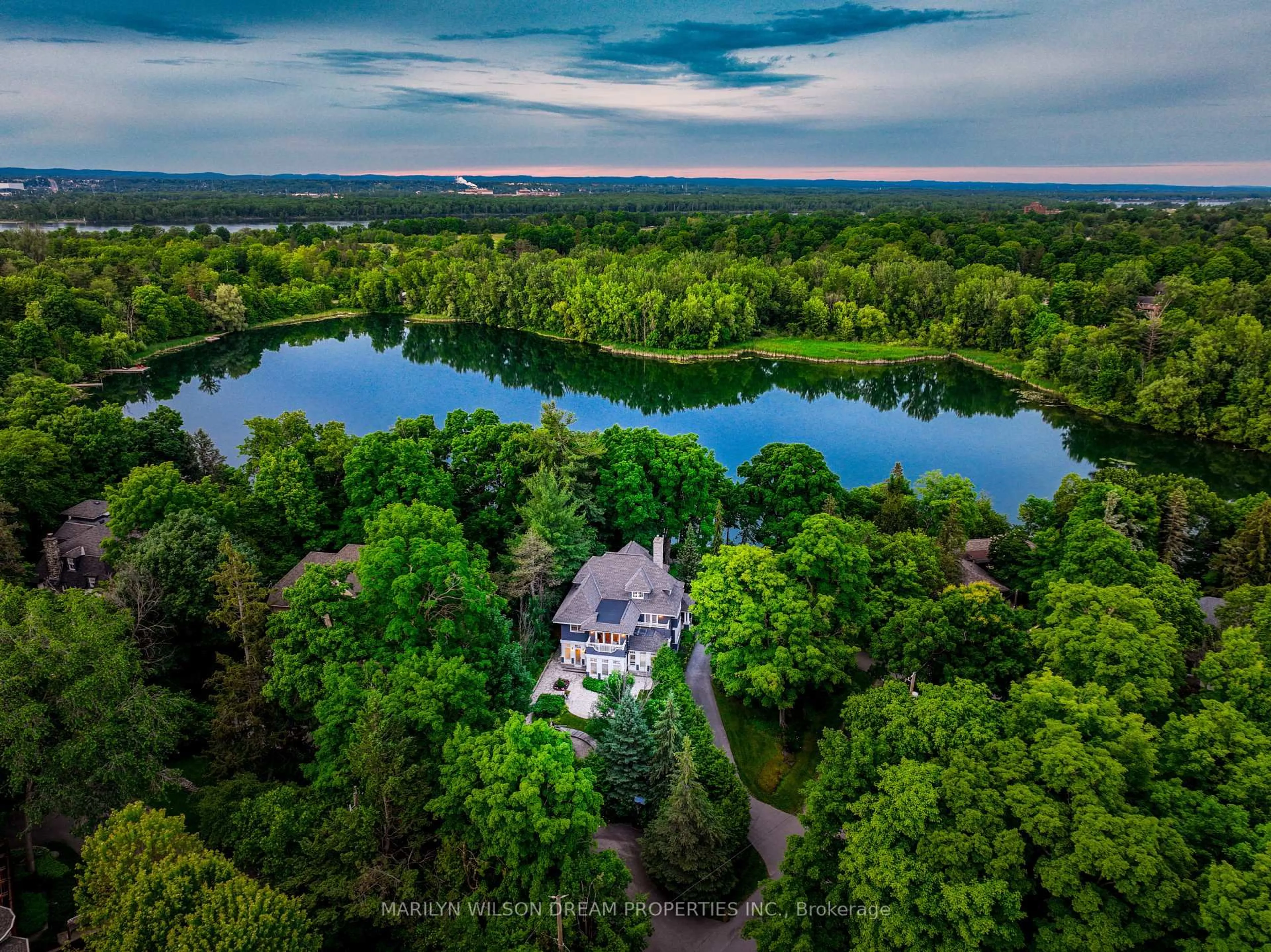 A pic from outside/outdoor area/front of a property/back of a property/a pic from drone, water/lake/river/ocean view for 597 Mariposa Ave, Ottawa Ontario K1M 0S3